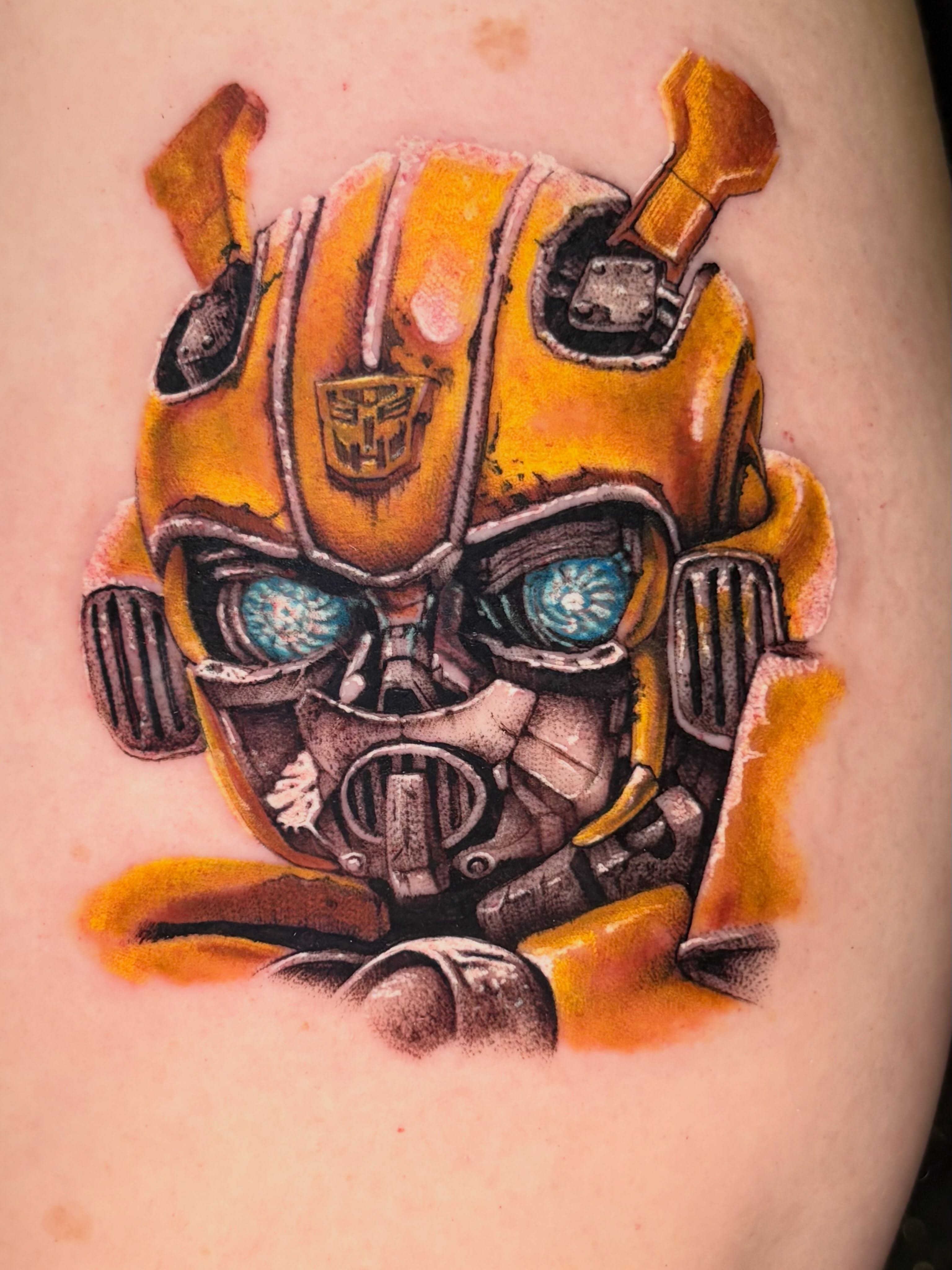 Bumblebee transformer realism tattoo on the forearm by Eddie Wolfe