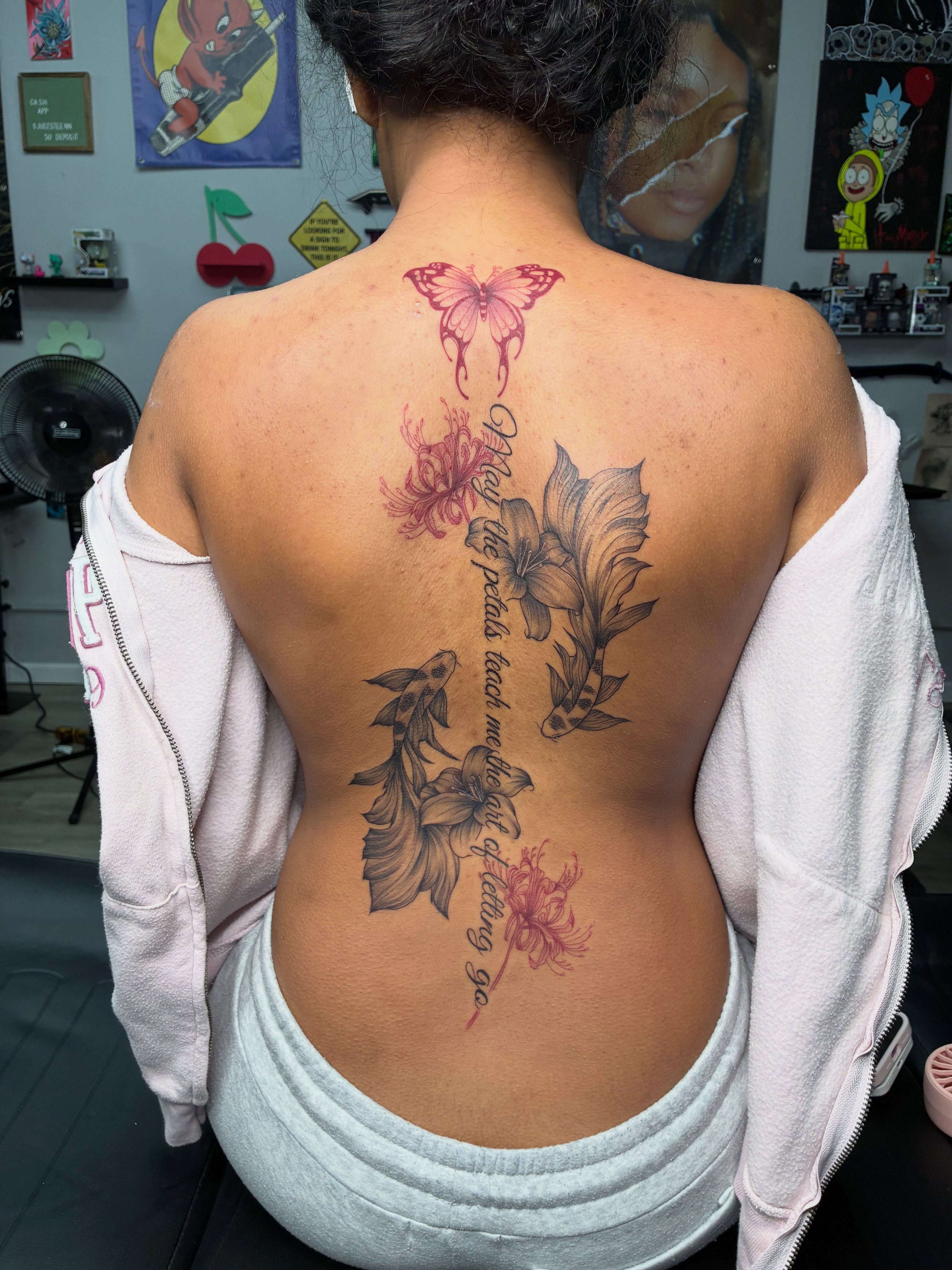 Flowers and butterfly new school tattoo on the back by Tattoos by Hailey