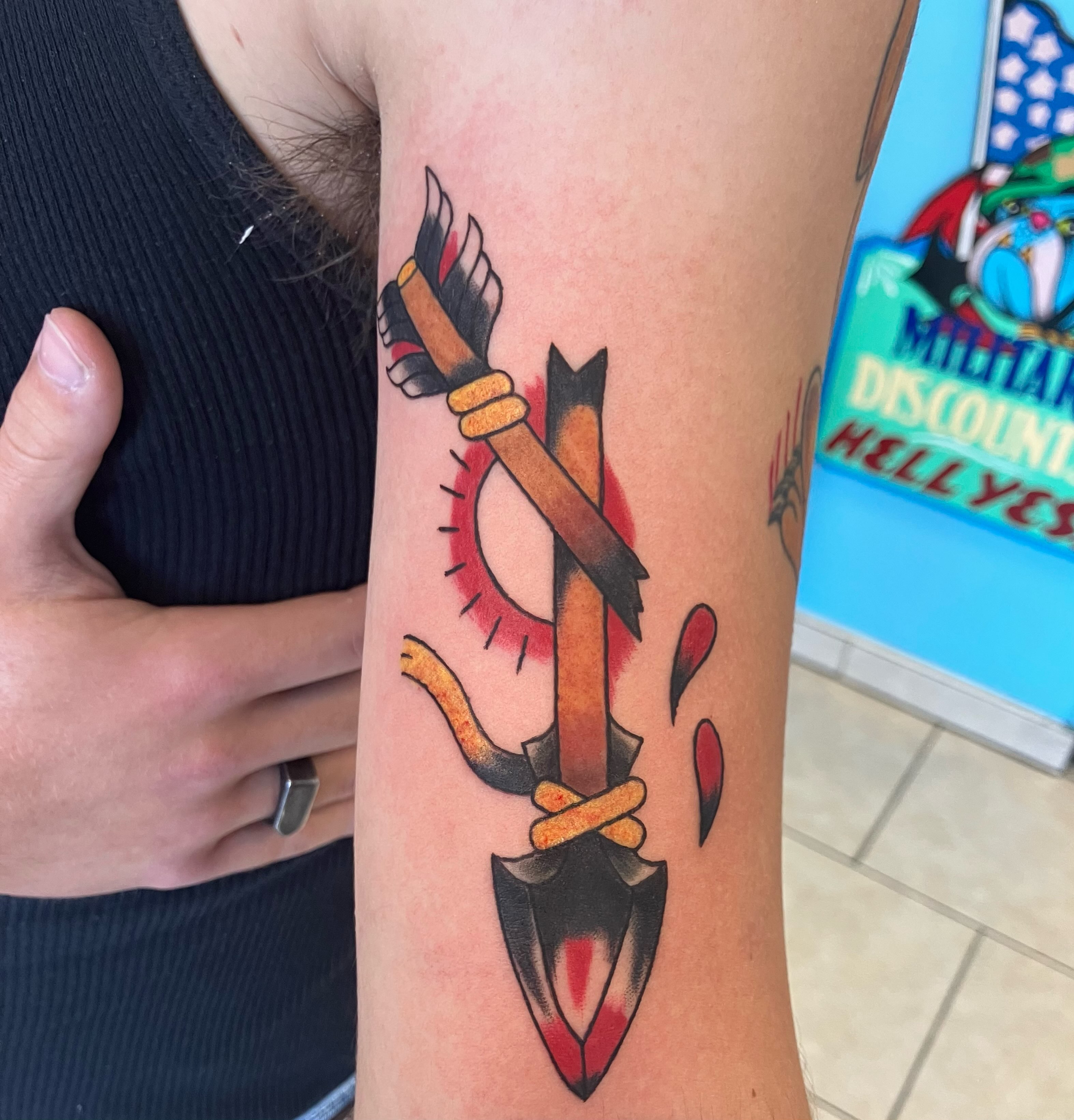 Arrow and bow American traditional tattoo on the forearm by Bryant Johnson