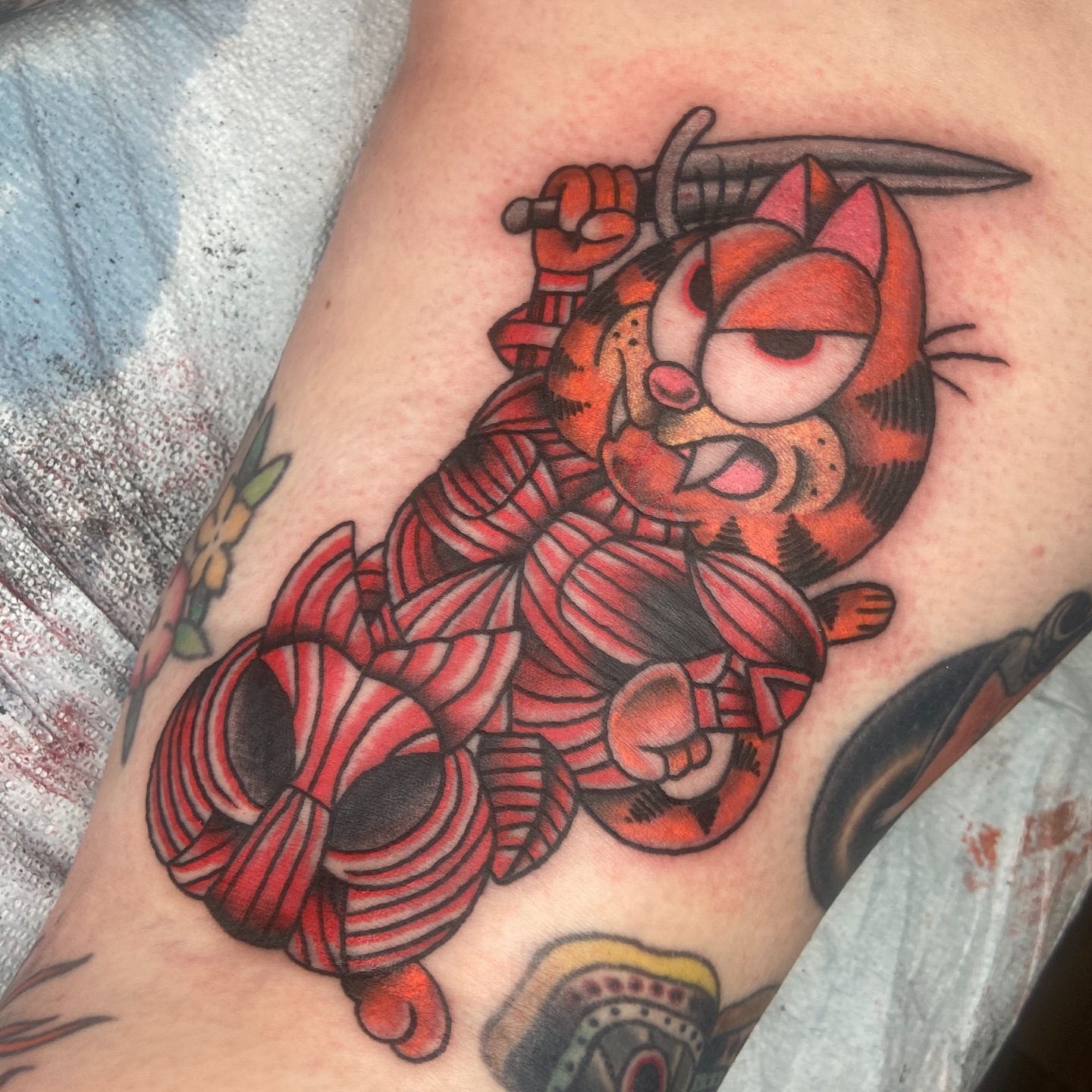 Cat with sword American traditional tattoo on the forearm by nicholas mcevoy, Boston, Massachusetts