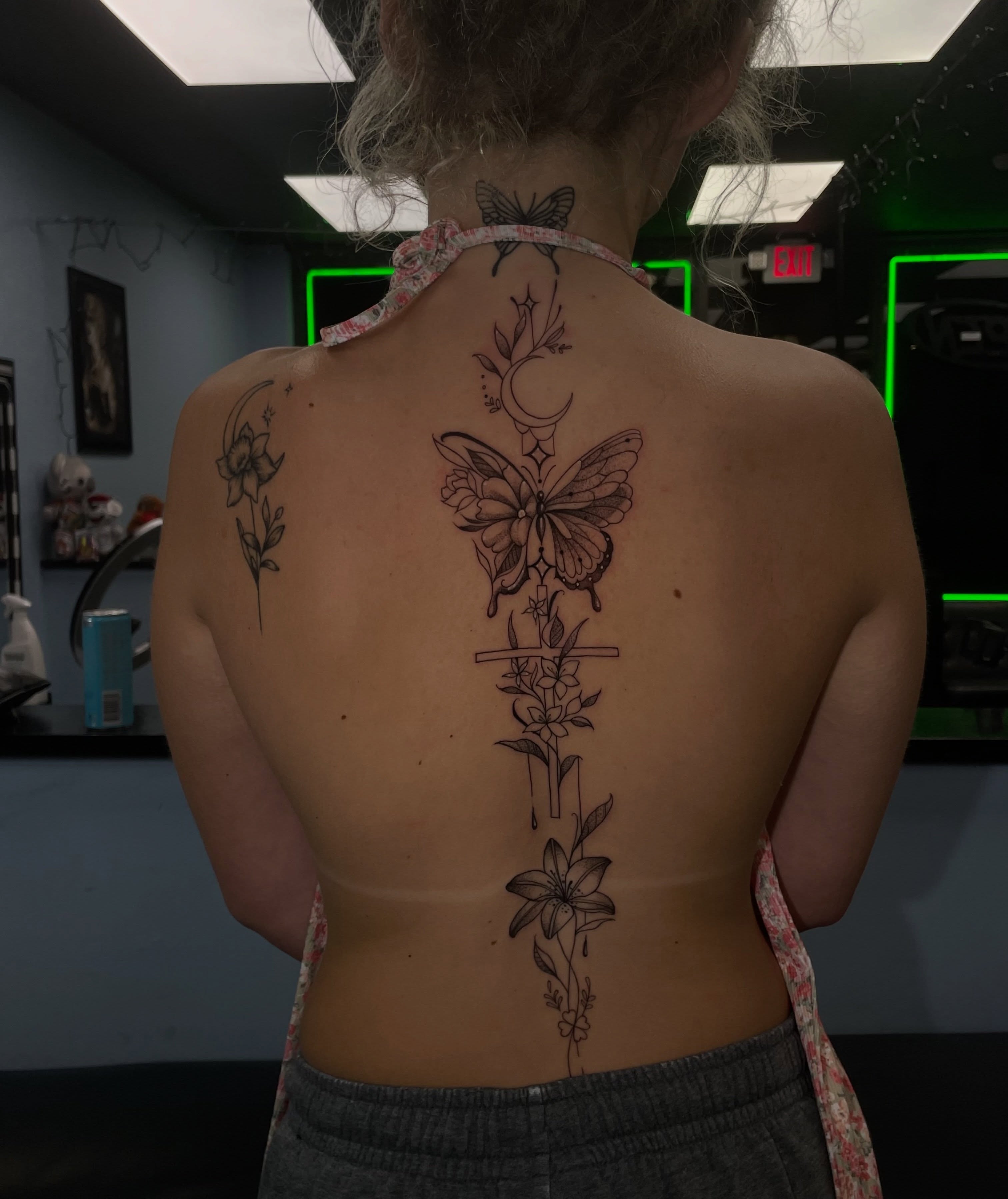Butterfly and floral arrangement black and grey tattoo on the back by Shadoww Espinoza