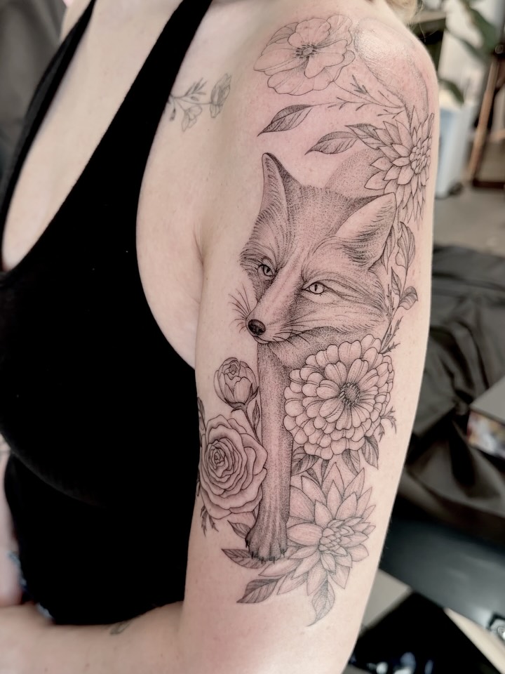 Fox and flowers realism tattoo on the shoulder by Anna
