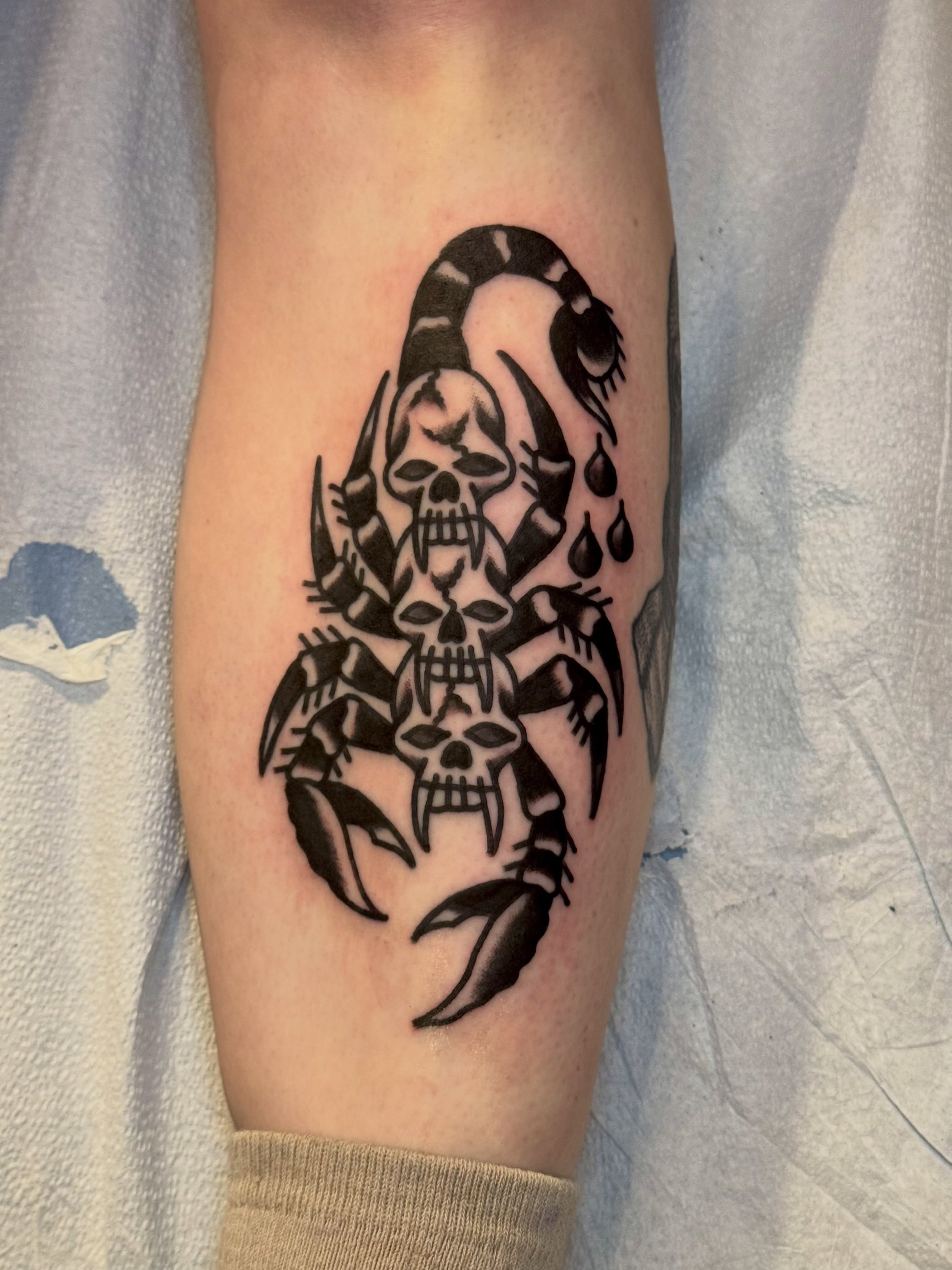 Scorpion black and grey tattoo on the forearm by Eli Bernal