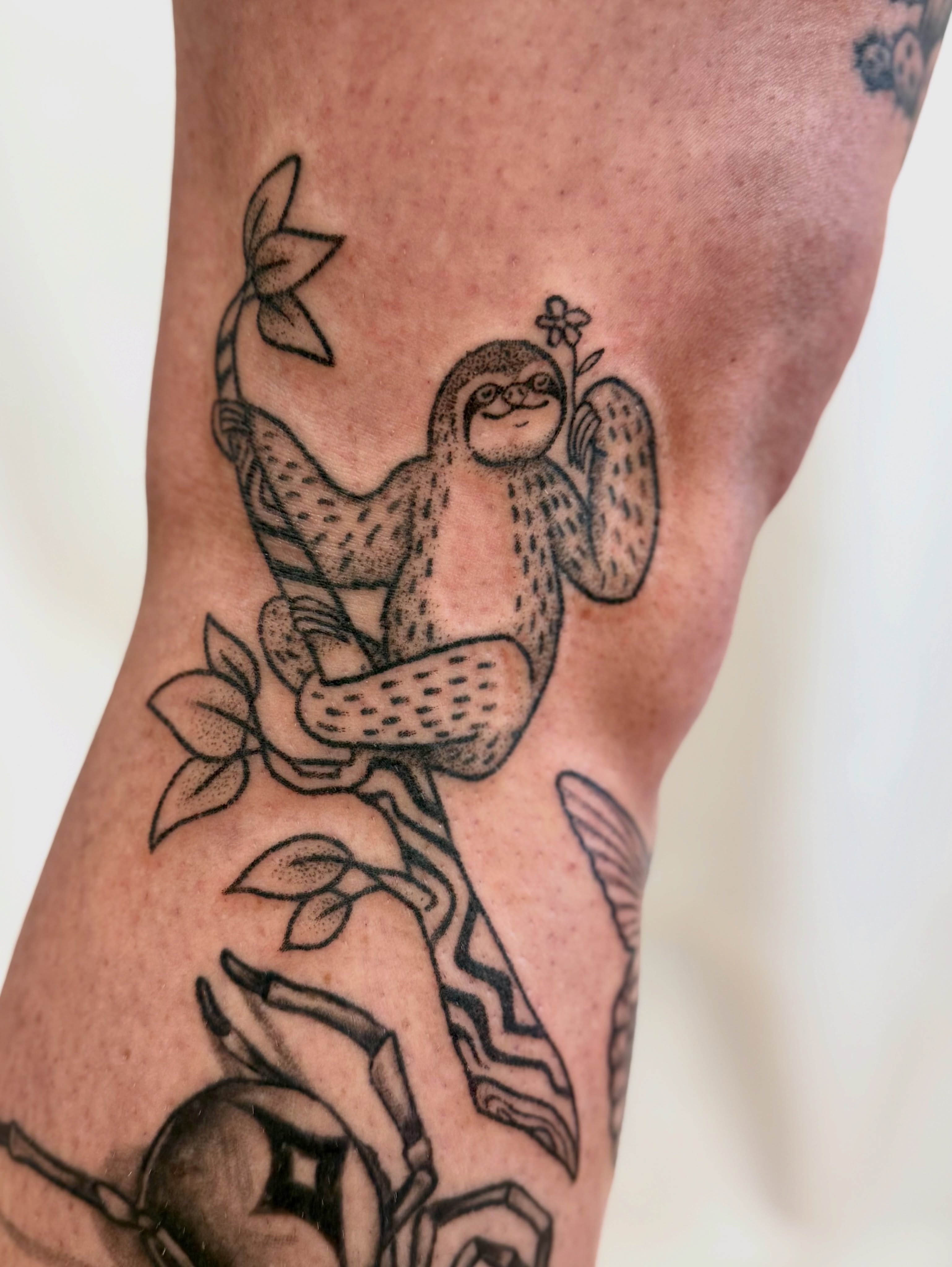 Sloth American traditional tattoo on the forearm by Melia Mariko