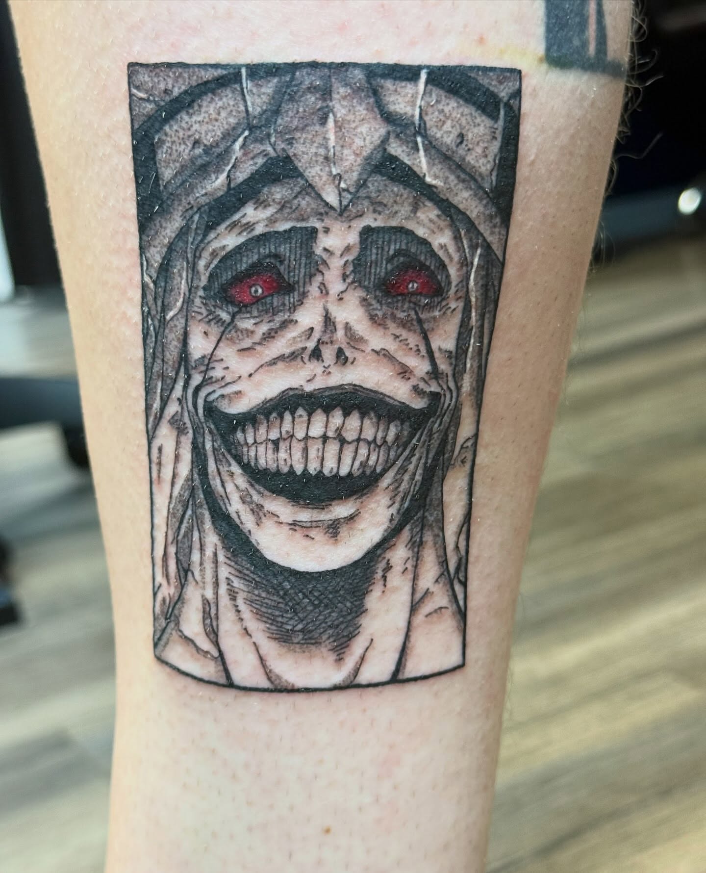 Joker dark realism tattoo on the forearm by Elena