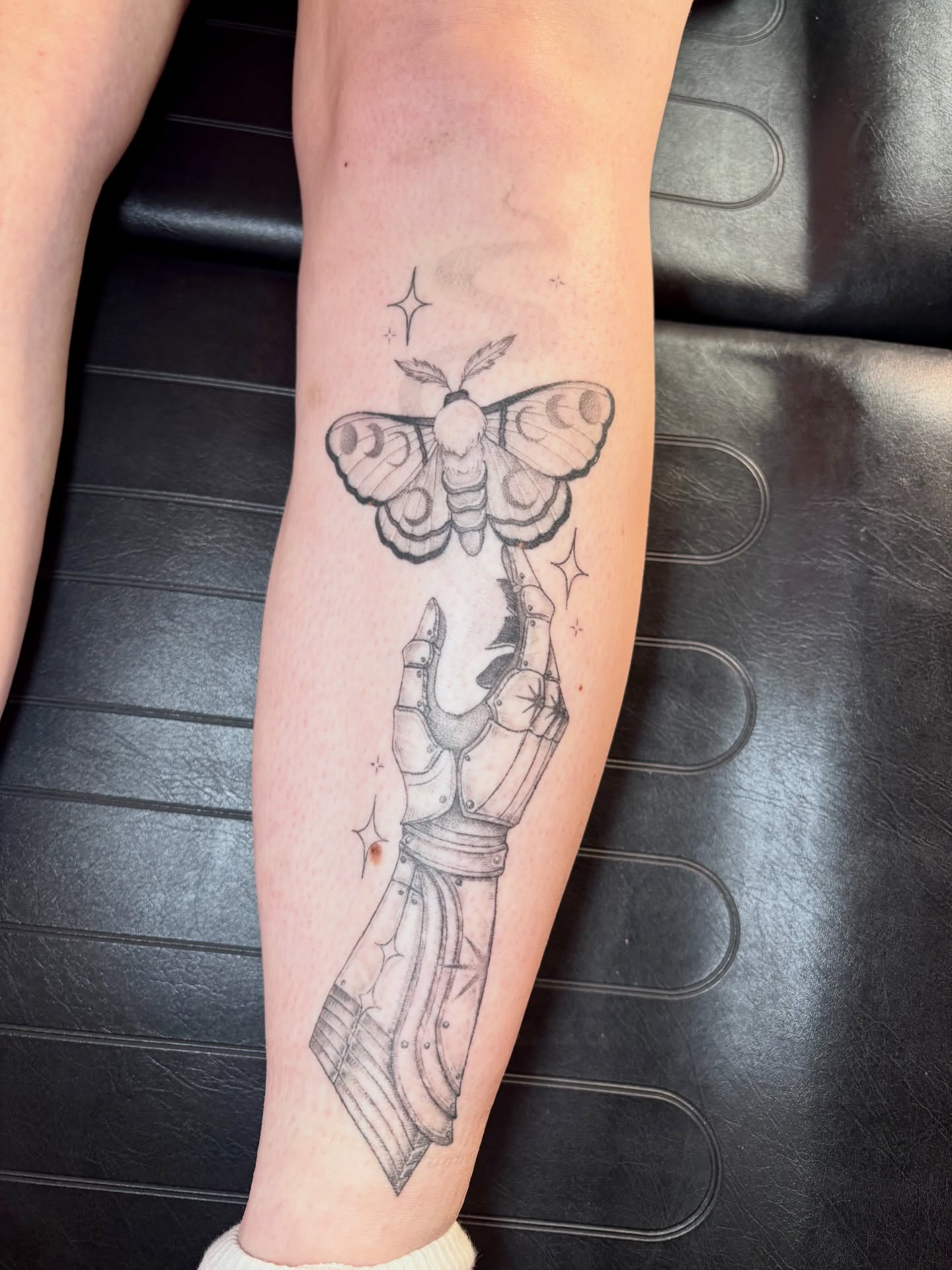 Moth and hand black and grey tattoo on the forearm by Charlotte Brown, Leeds, England