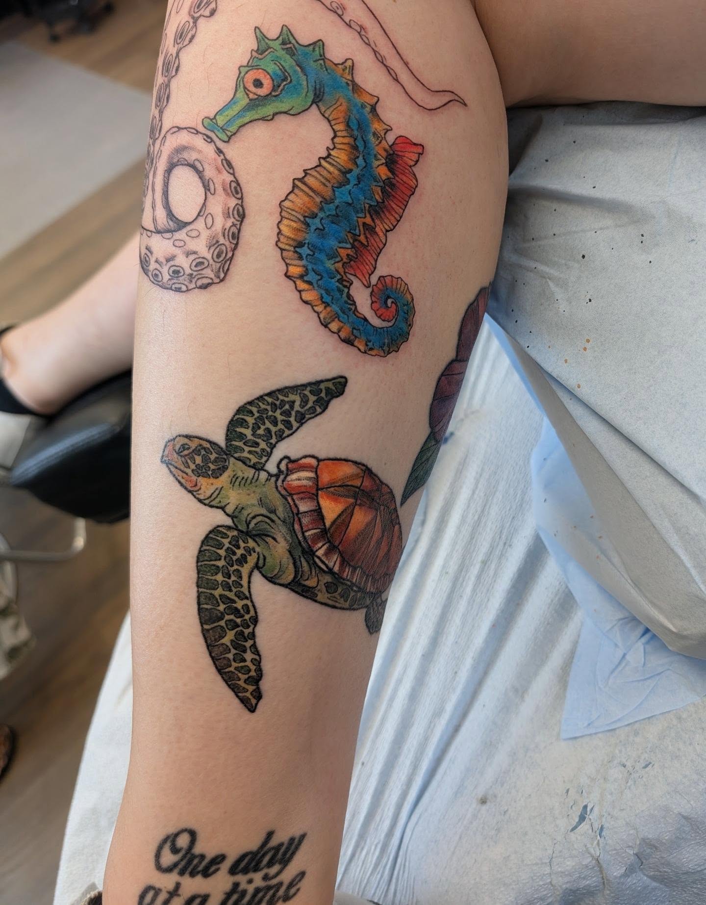 Sea turtle and seahorse new school tattoo on the forearm by Devon Ward, Portland, Oregon