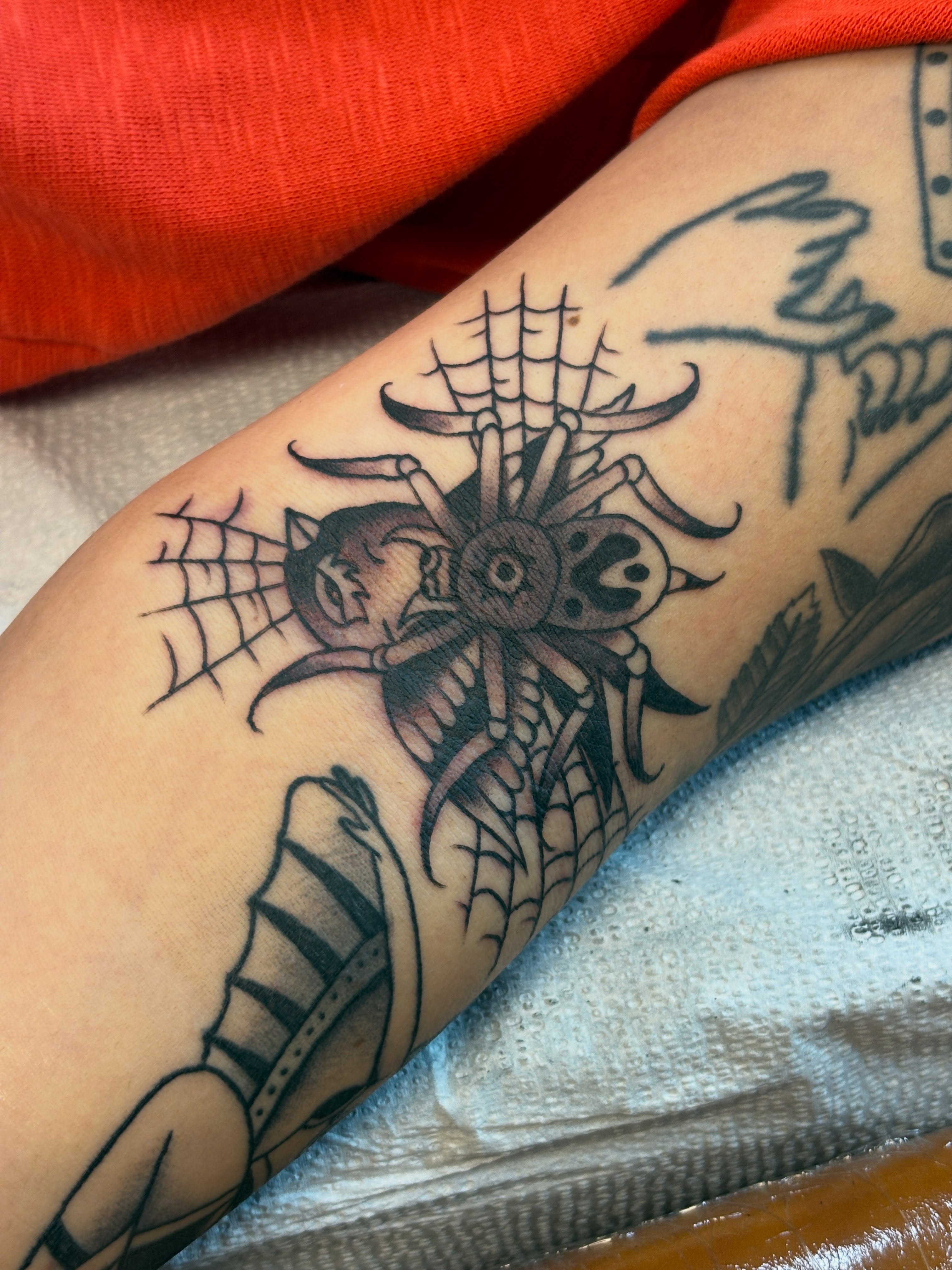 Spider and skeleton black and grey tattoo on the forearm by Sammy Tattoo, Austin, Texas