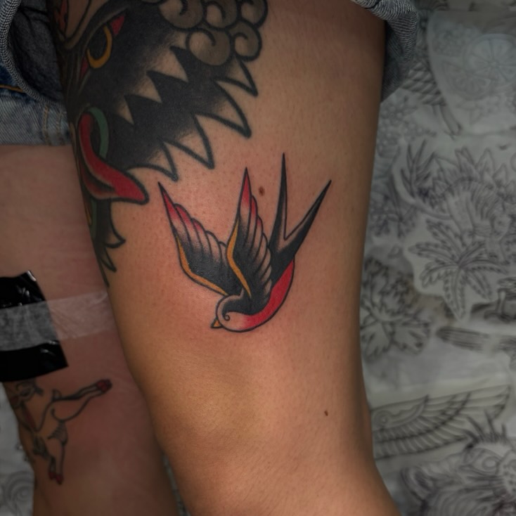 Swallow American traditional tattoo on the forearm by Danelle ✶ Nashville Tattooer