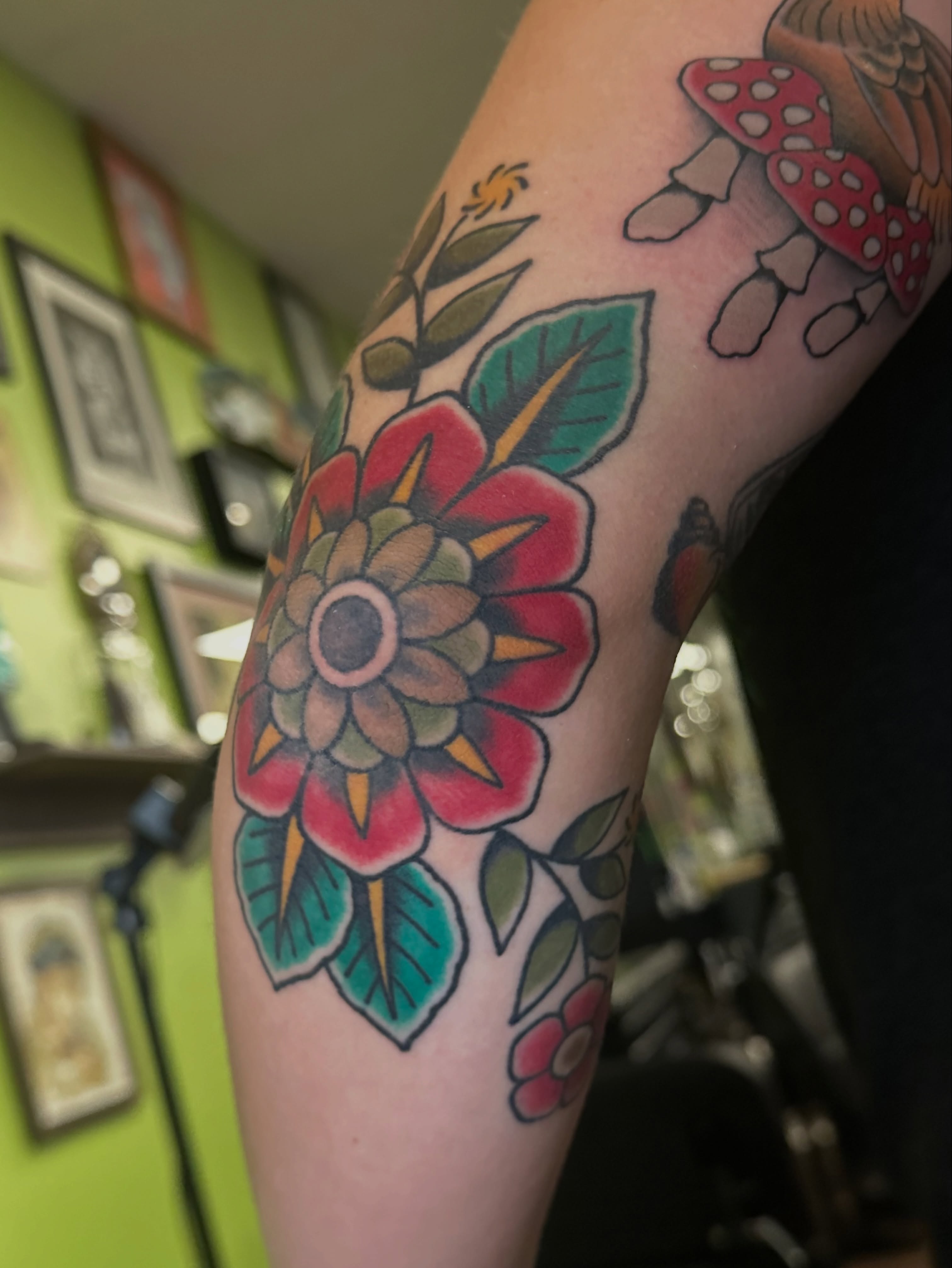 Floral bouquet American traditional tattoo on the forearm by Lauren Howard Tattoos