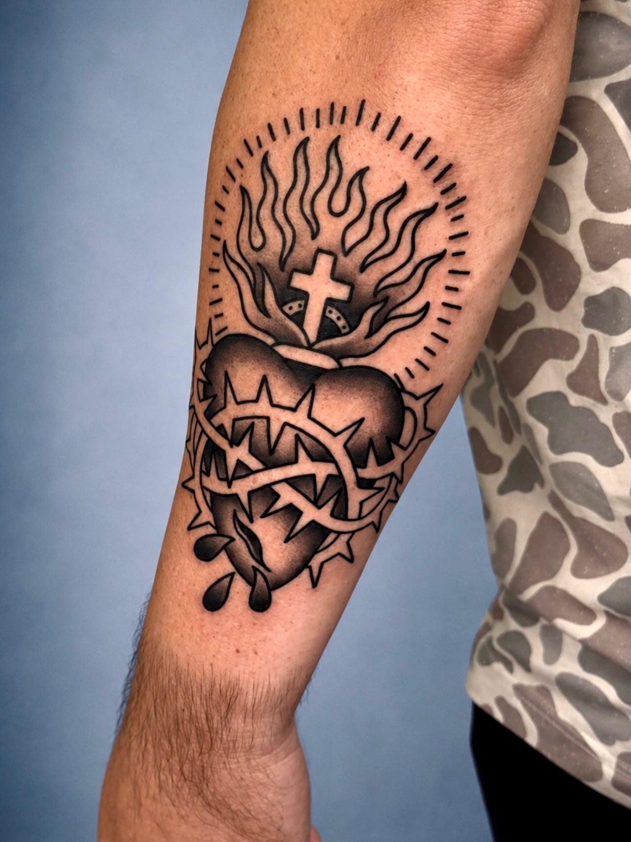 Sacred heart black and grey tattoo on the forearm by Tattoos By Chico
