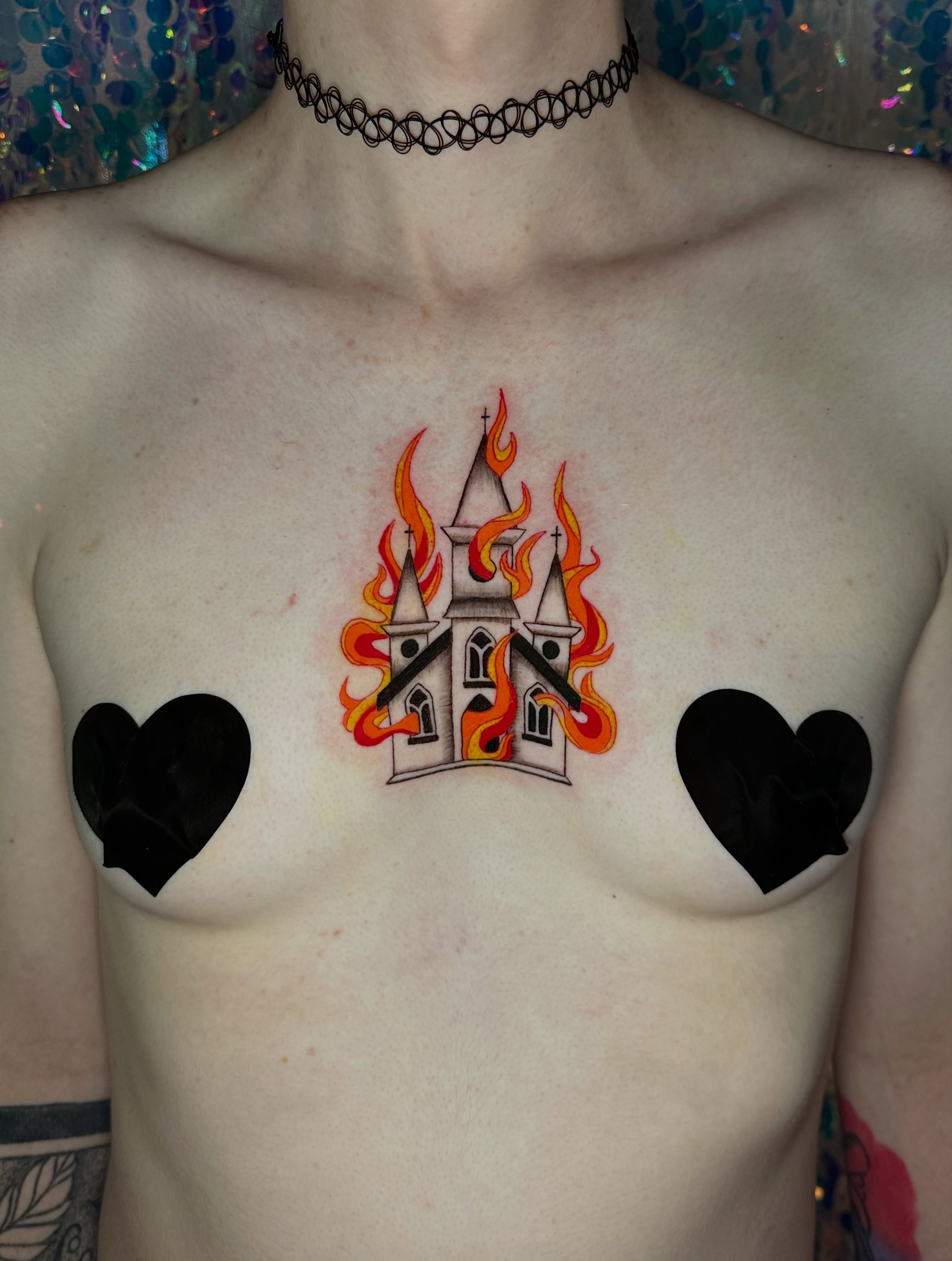Castle on fire neo-traditional tattoo on the chest by Sunny, Austin, Texas