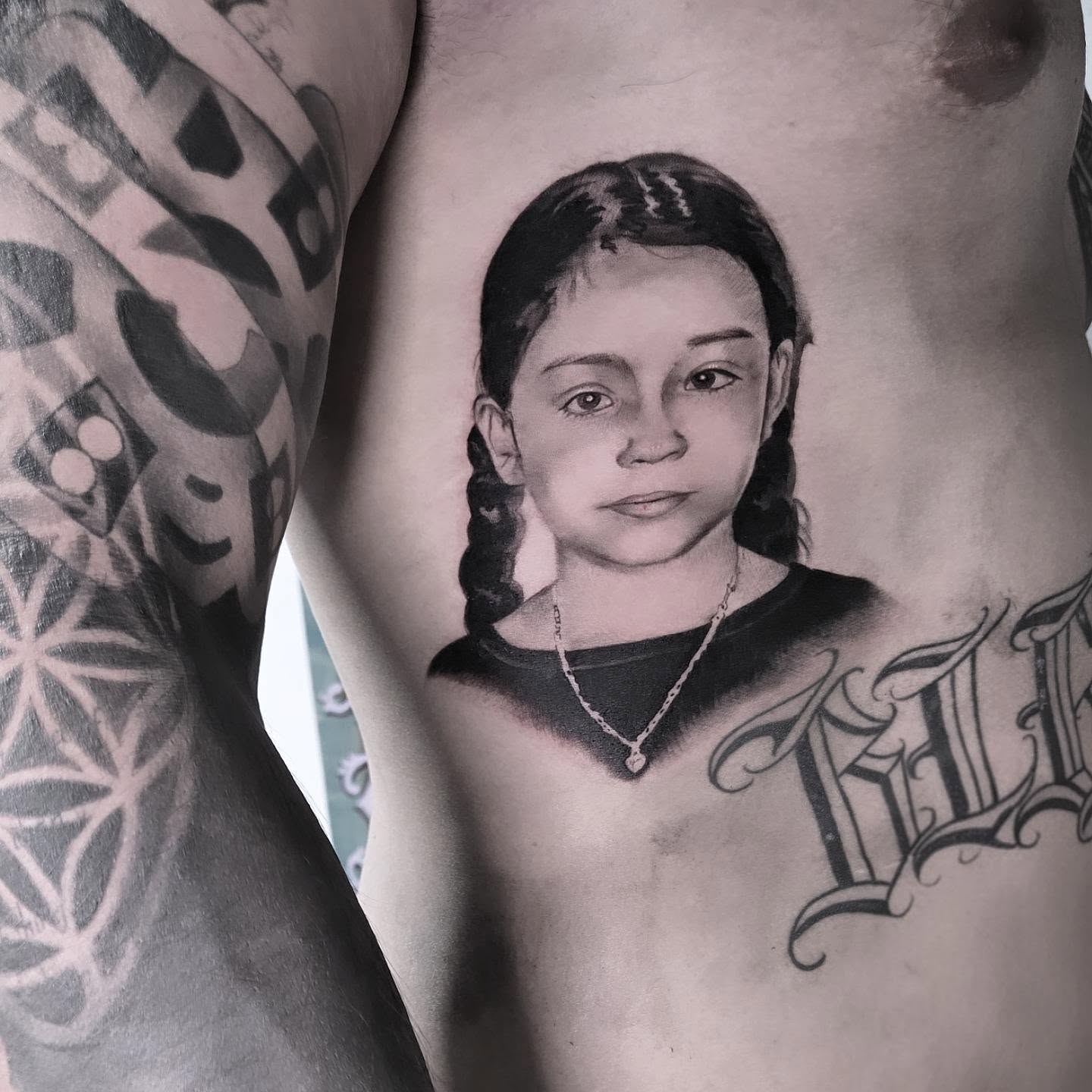 Portrait of a young girl realism tattoo on the chest by Yvette Cebreros