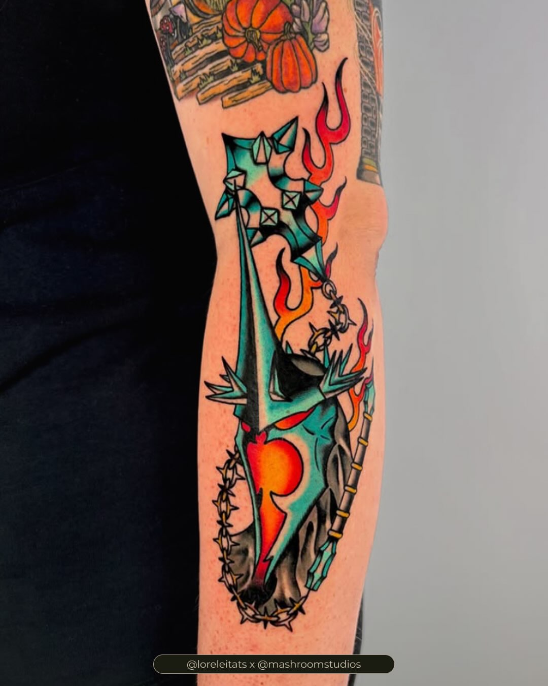 Sword and heart geometric tattoo on the forearm by Lorelei