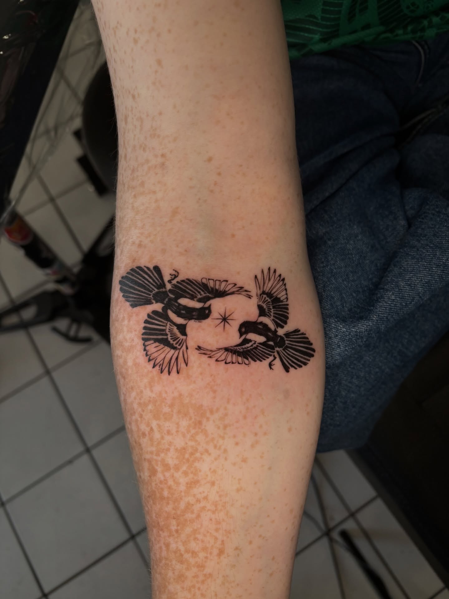 Birds black and grey tattoo on the forearm by Chloe Shay