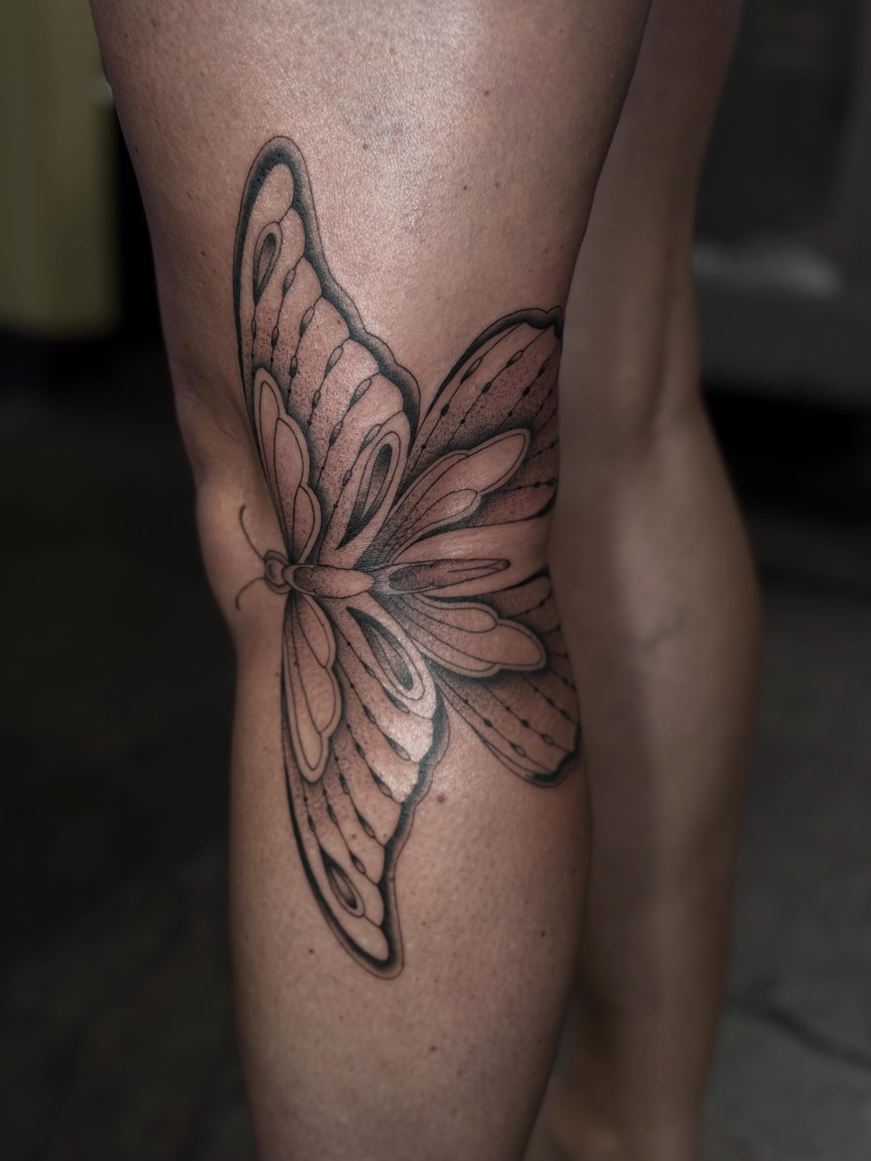 Butterfly black and grey tattoo on the thigh by chloe jeanel estrada