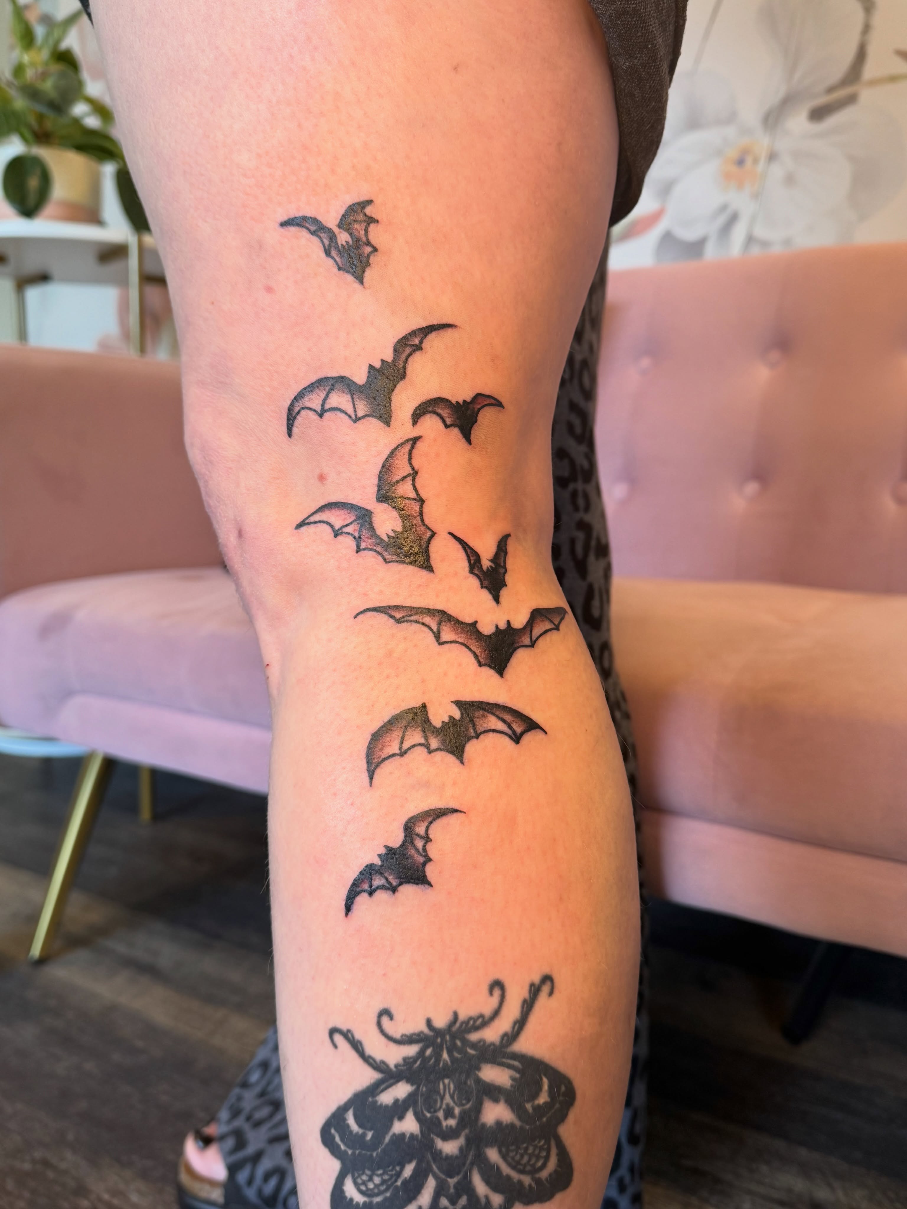 Bat sequence black and grey tattoo on the forearm by Kinzi Brown