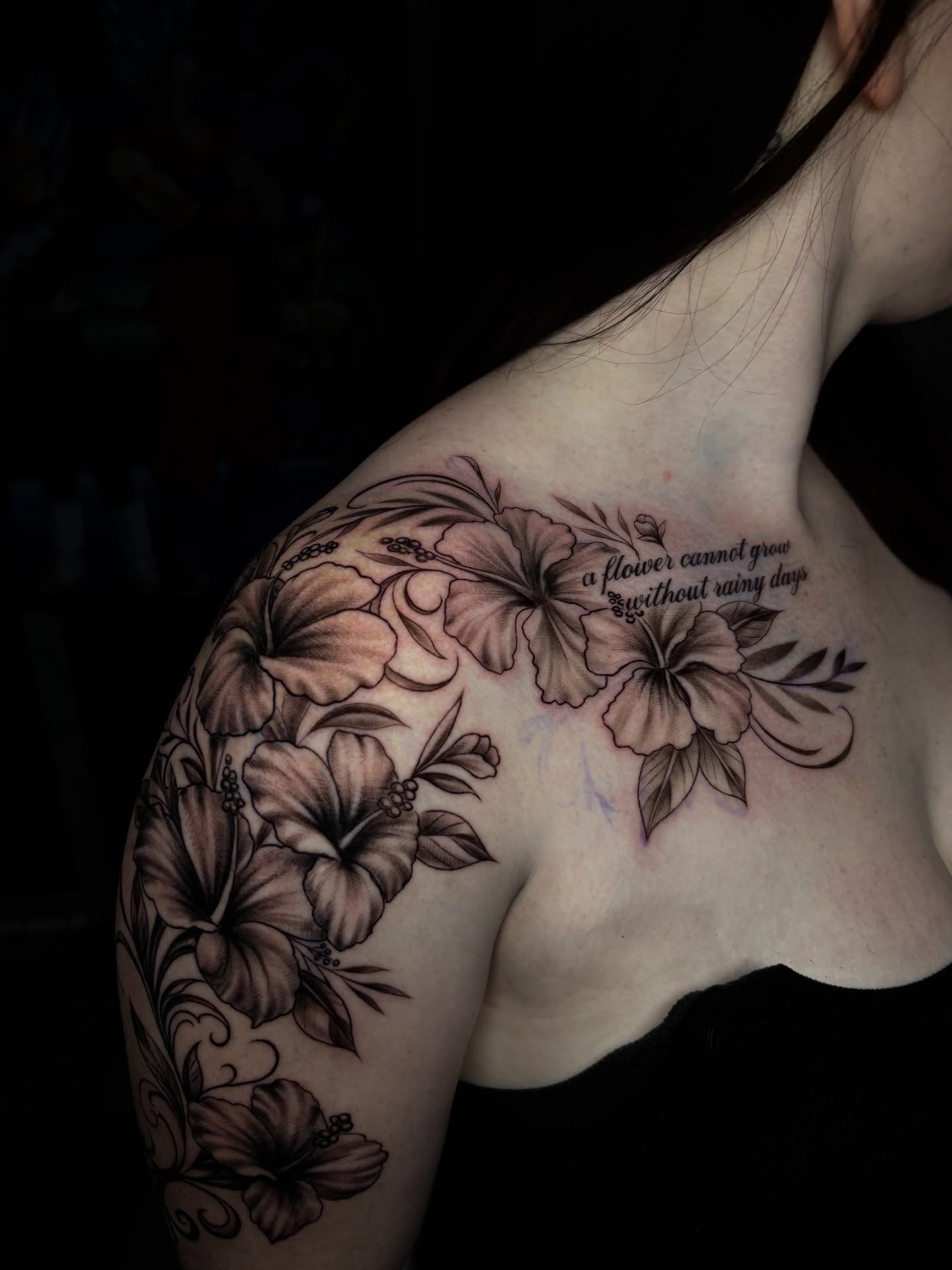 Flowers black and grey tattoo on the shoulder by Nikko