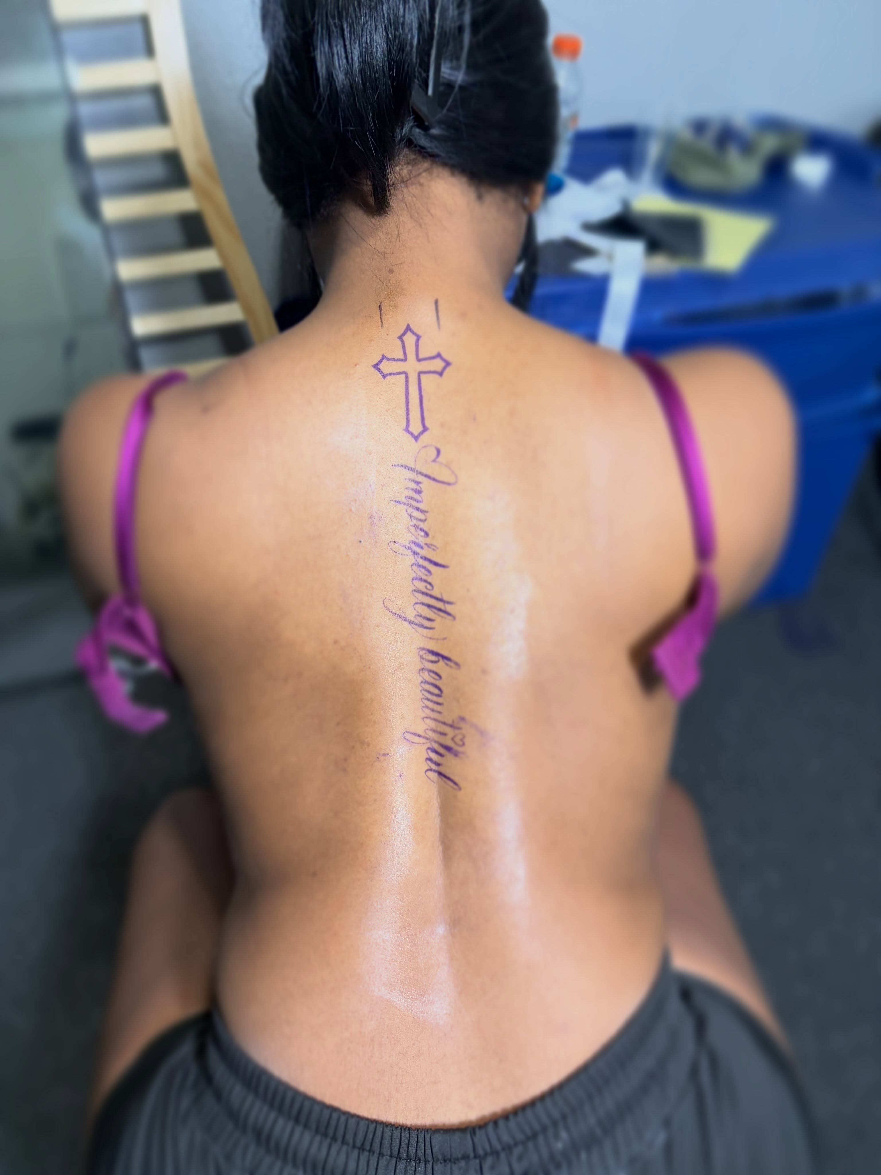 Cross and cursive text lettering script tattoo on the back by 216 Tattoos 🥰