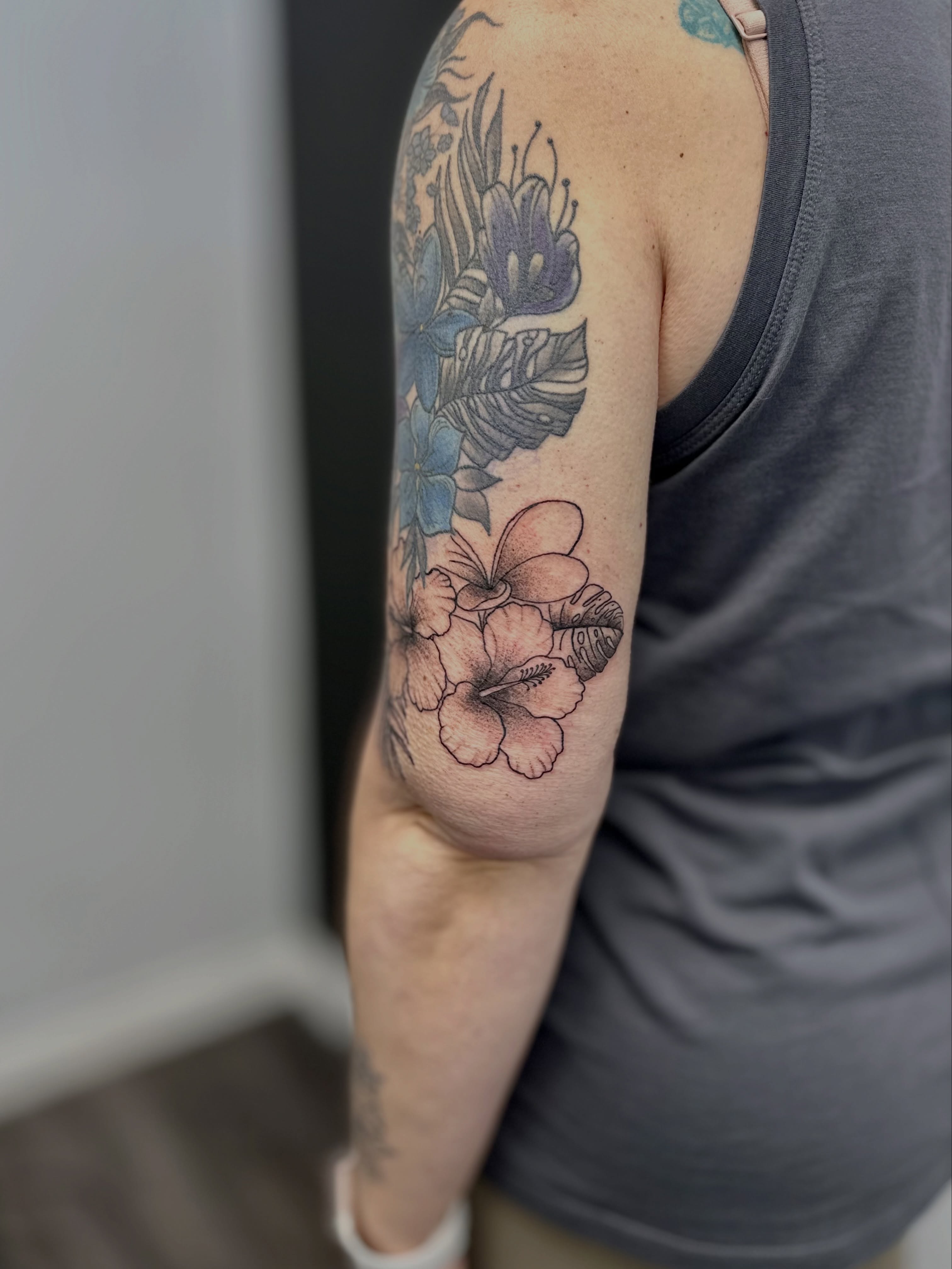 Floral arrangement new school tattoo on the forearm by AJ