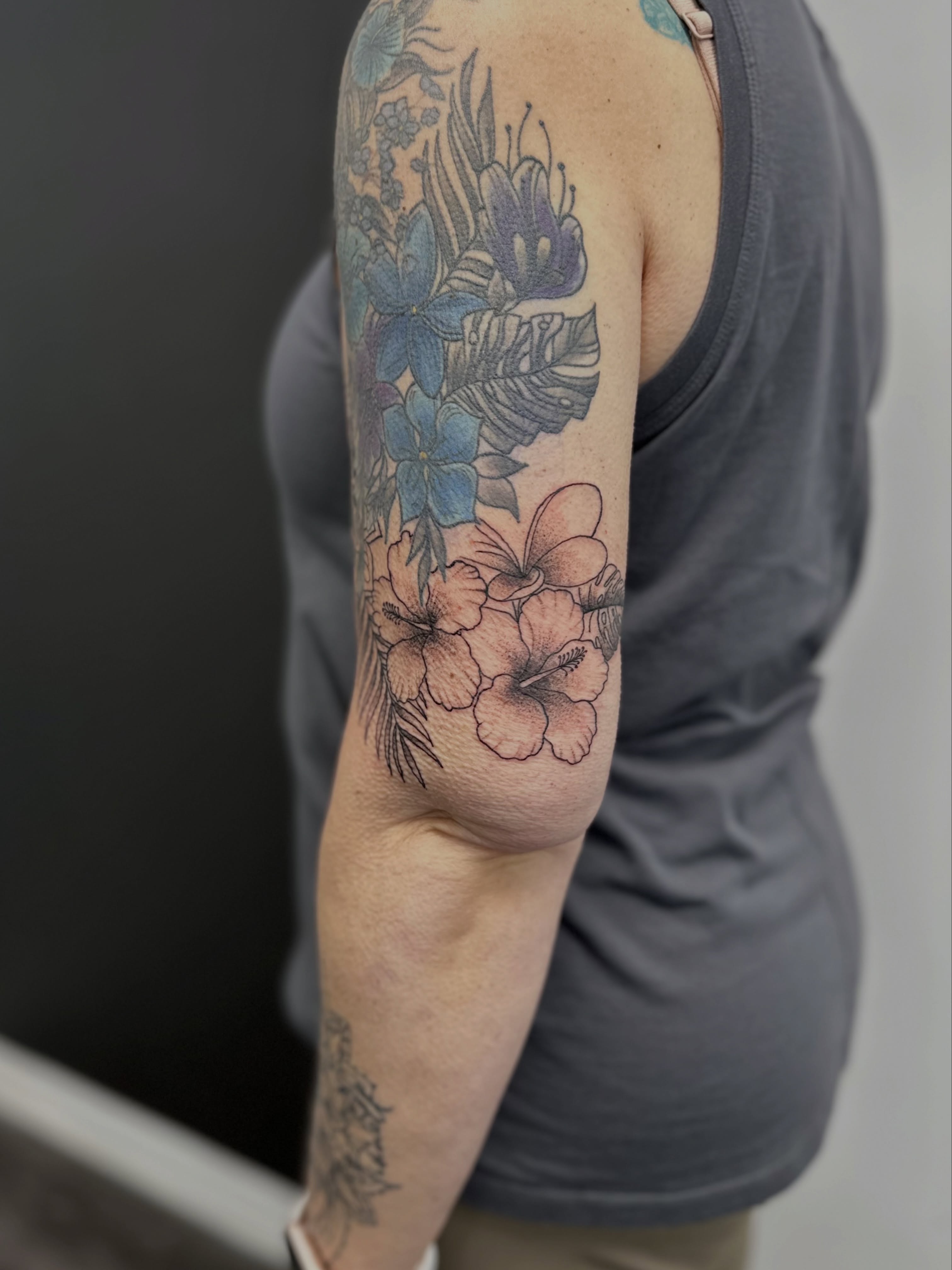 Floral arrangement new school tattoo on the forearm by AJ