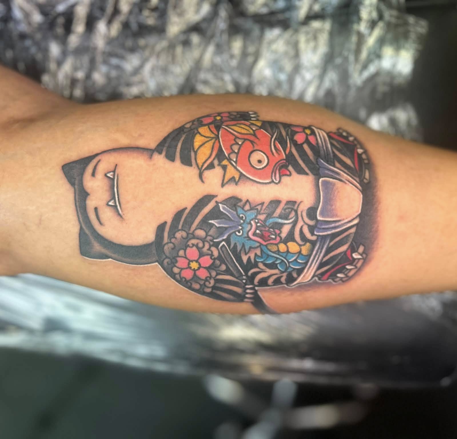 Japanese mask American traditional tattoo on the forearm by Daemion