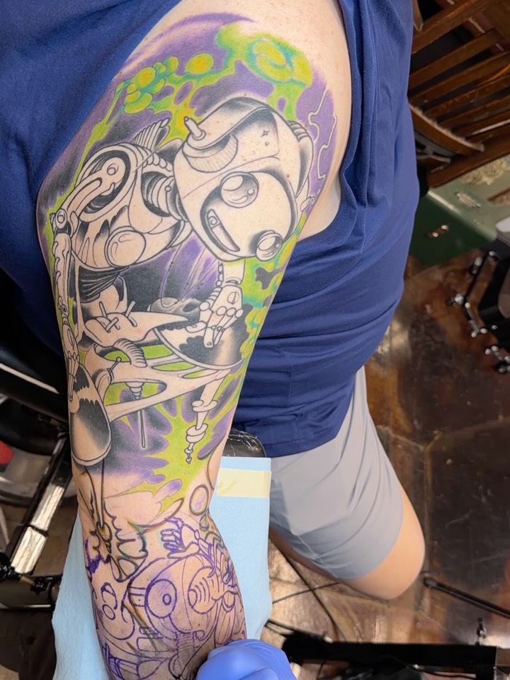 Mechanical robot anime tattoo on the upper arm by JoshUA Bowers, Des Moines, Iowa