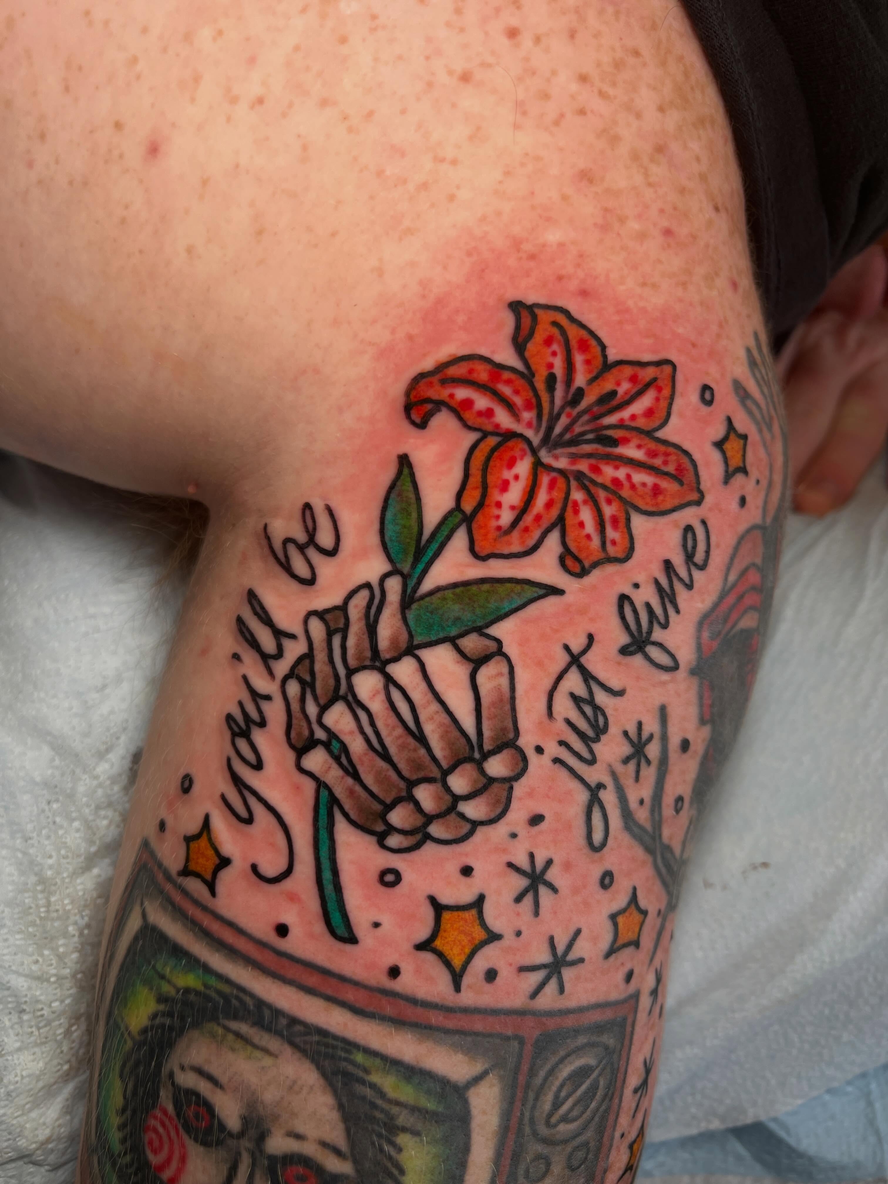 Lily and skeleton hands new school tattoo on the forearm by Mat Helton, Fairborn, Ohio
