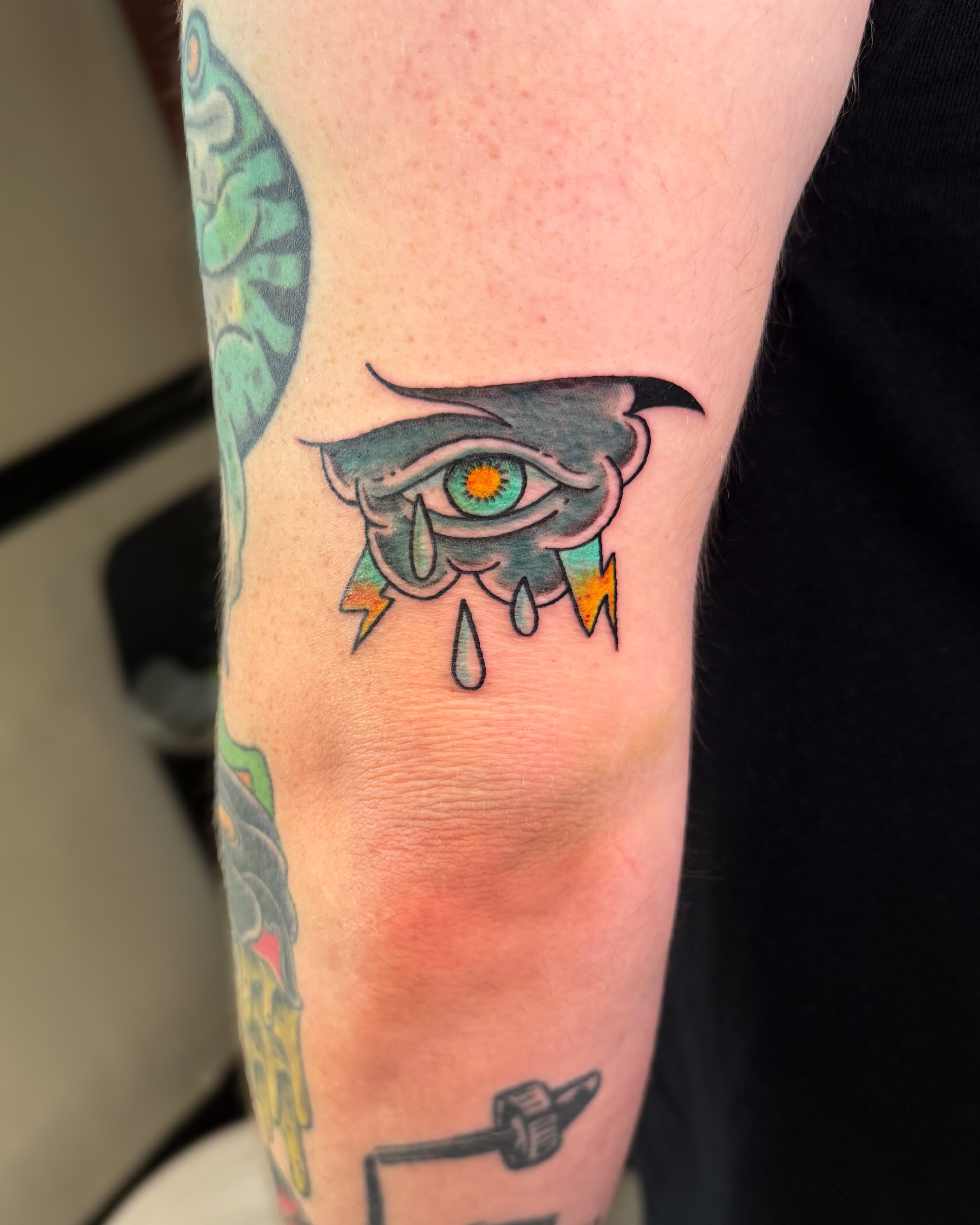 Eye with lightning bolts neo-traditional tattoo on the forearm by Ivy-Jade Edwards, Memphis, Tennessee