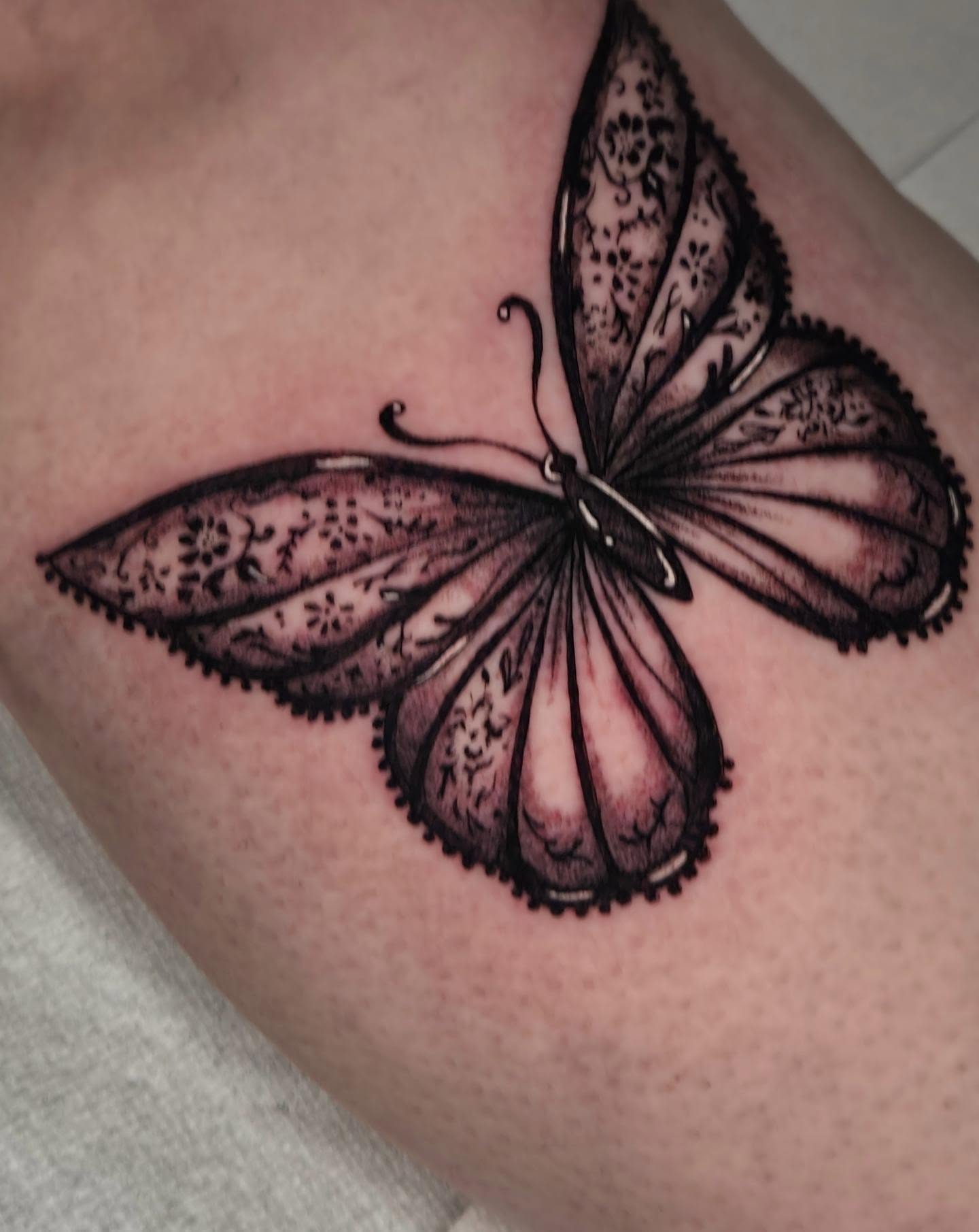 Butterfly ornamental tattoo on the thigh by Devin 🖤