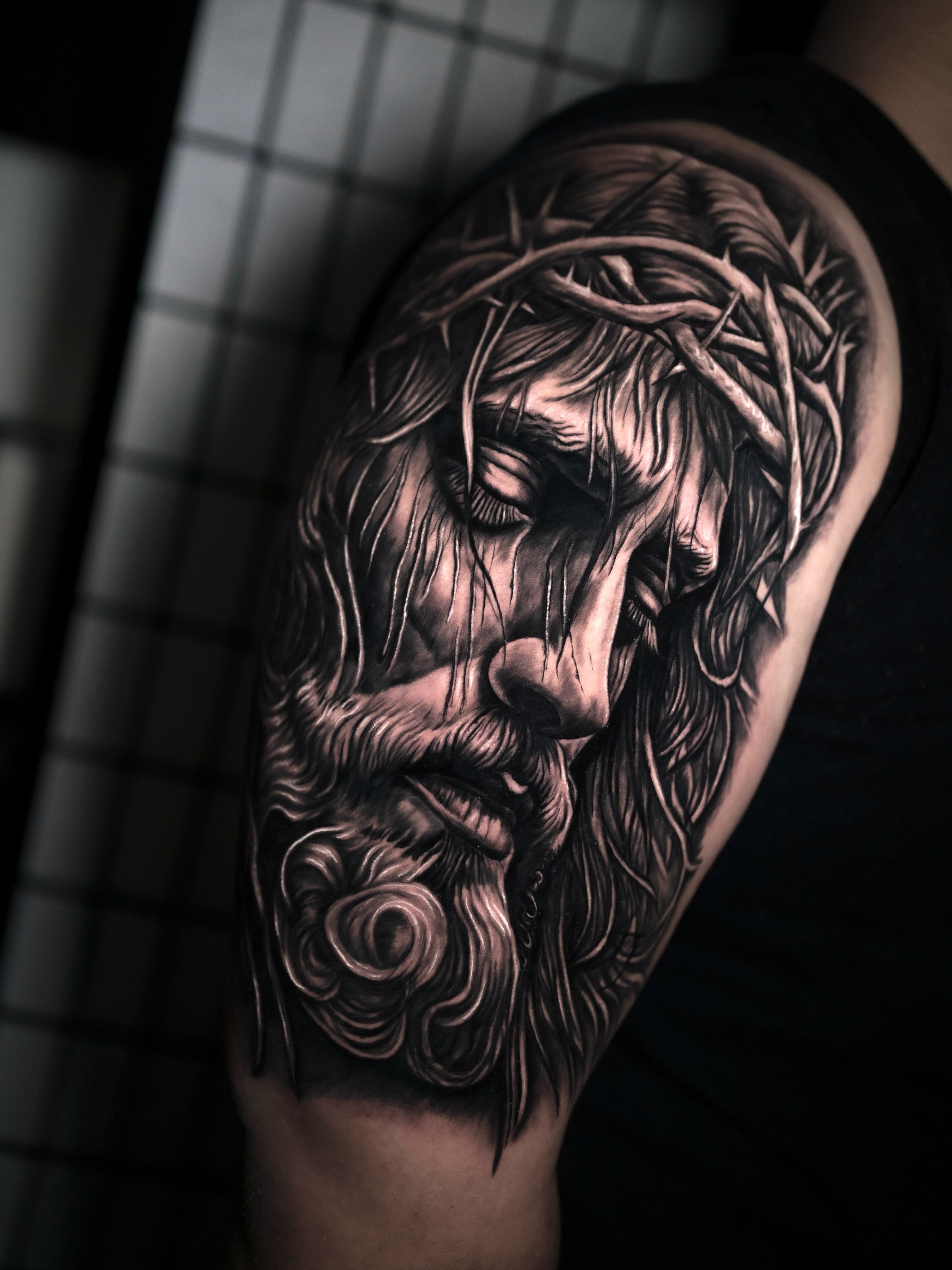 Jesus Christ realism tattoo on the shoulder by Juan David Arias