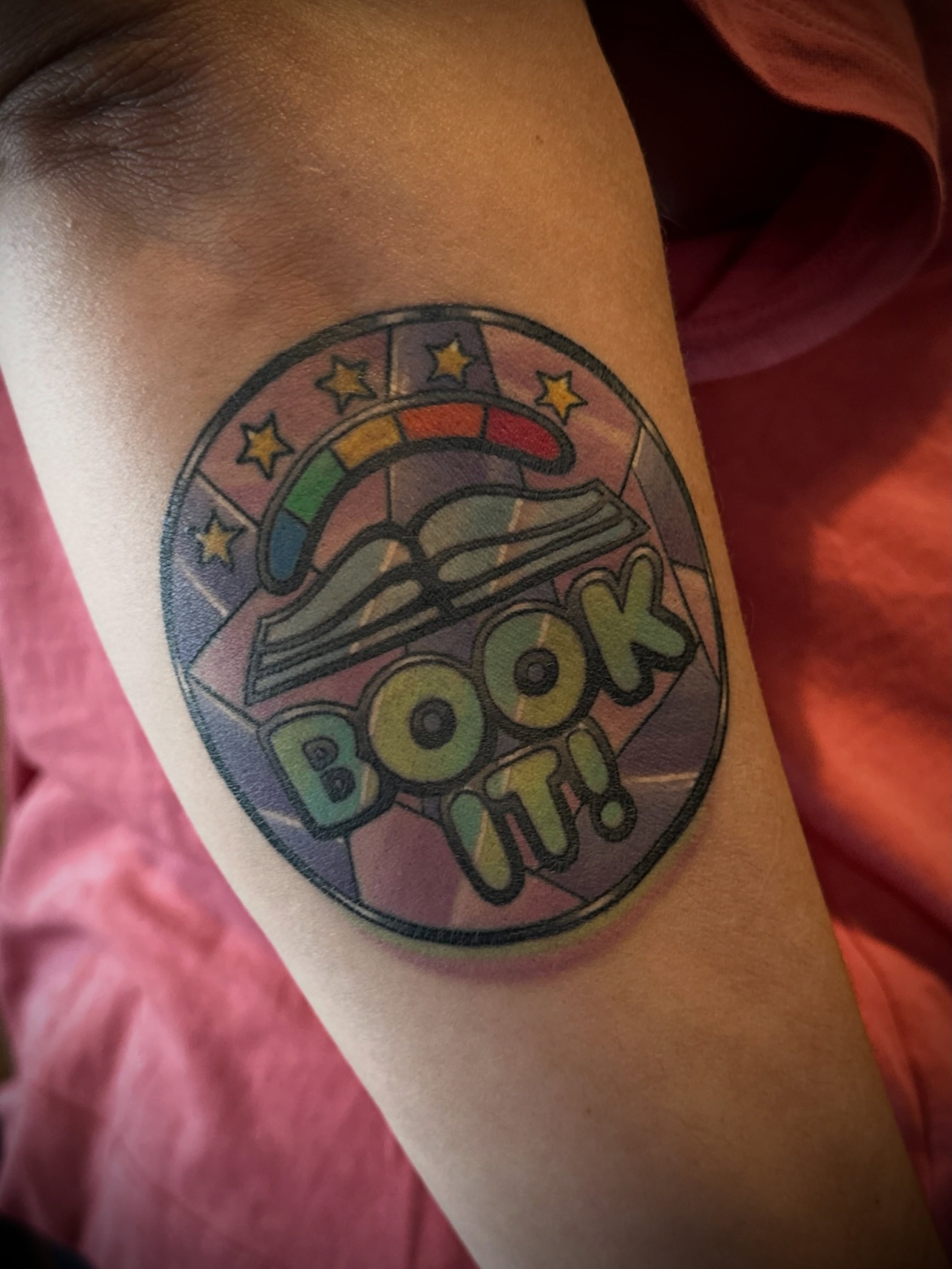 Book new school tattoo on the forearm by B.G. Germershausen