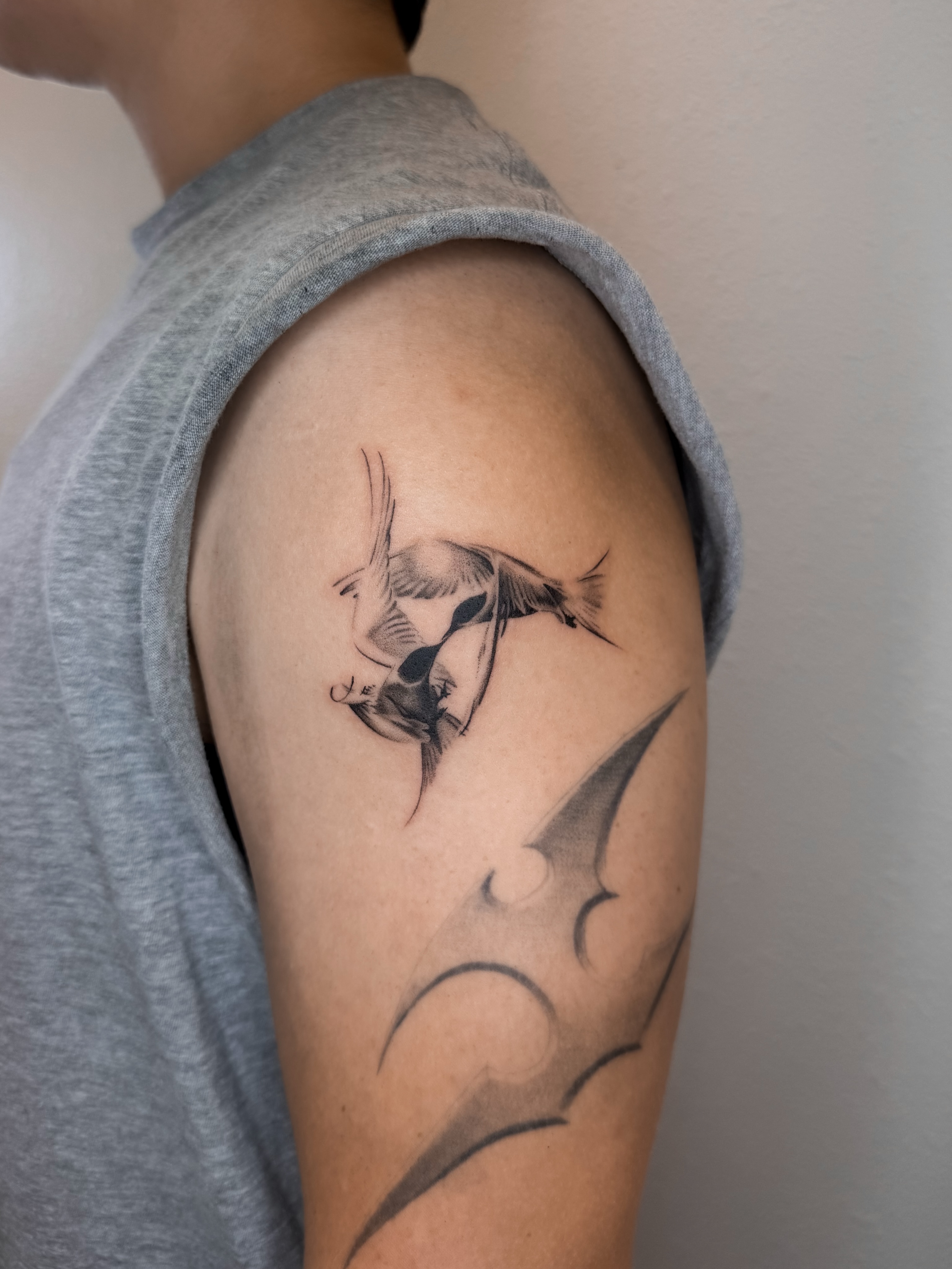 Fish black and grey tattoo on the shoulder by Rylee
