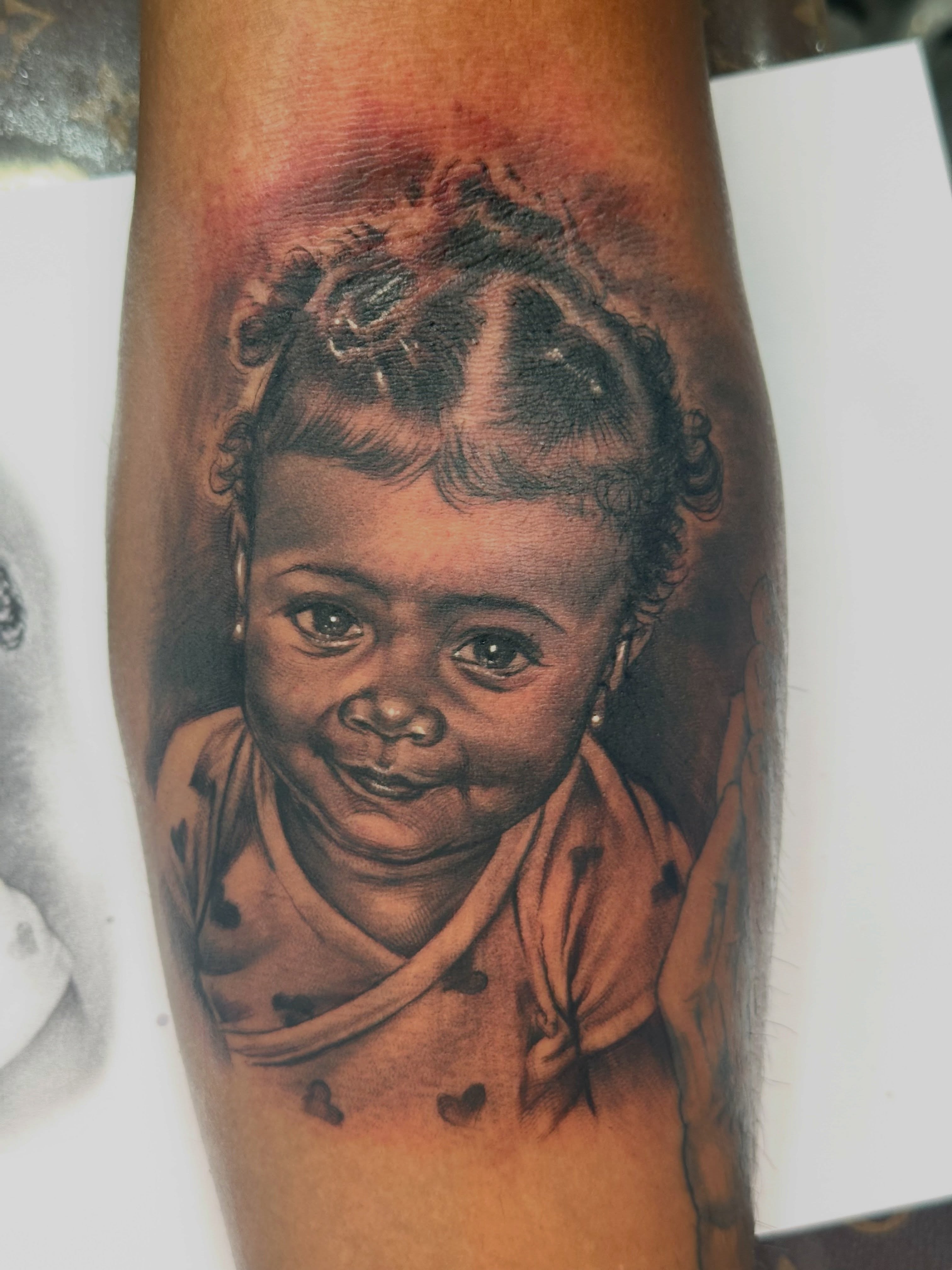 Child portrait realism tattoo on the forearm by guinn_art_tatts, Le Moule