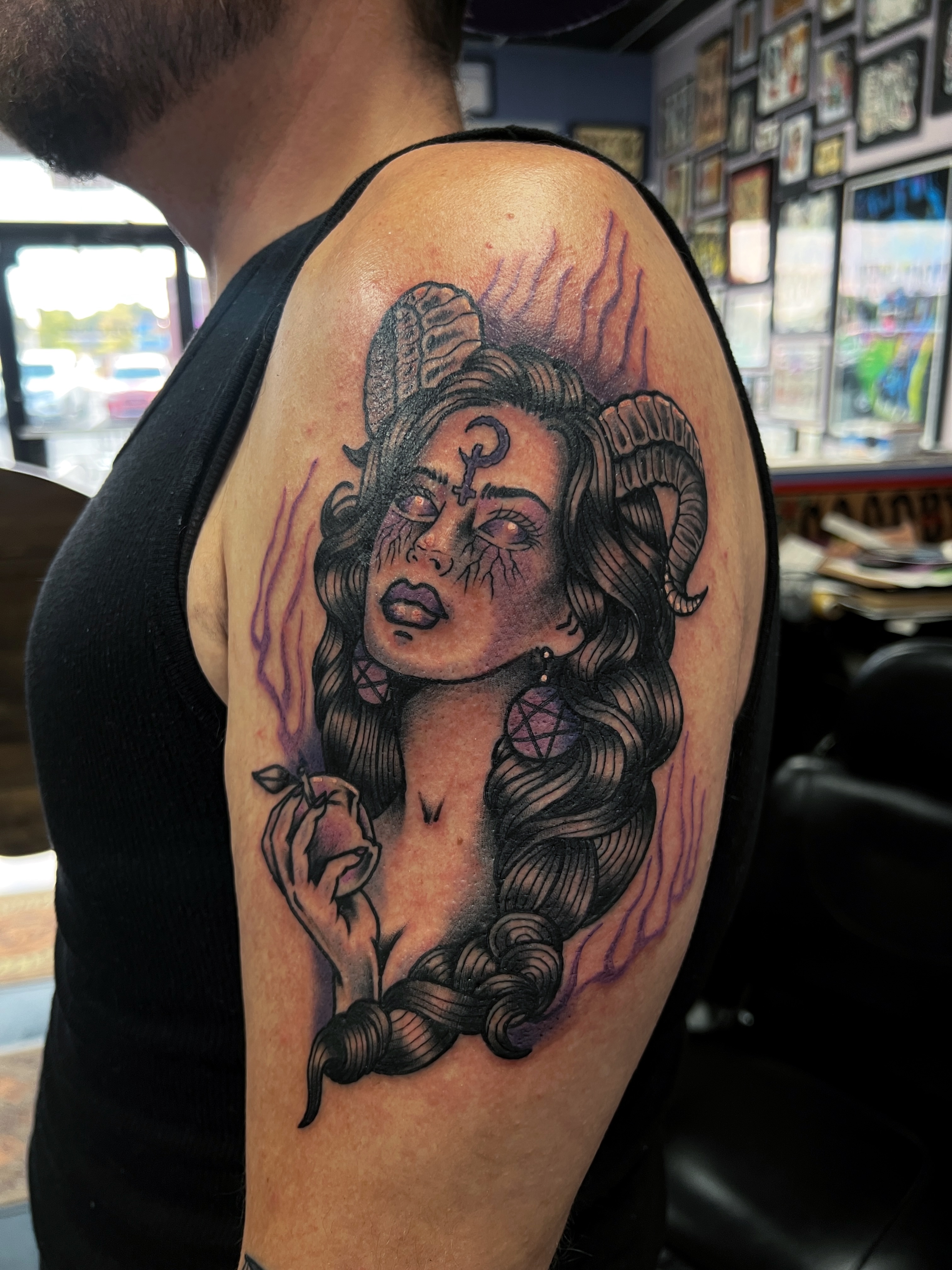 Woman with ram horns neo-traditional tattoo on the shoulder by Brian Mock