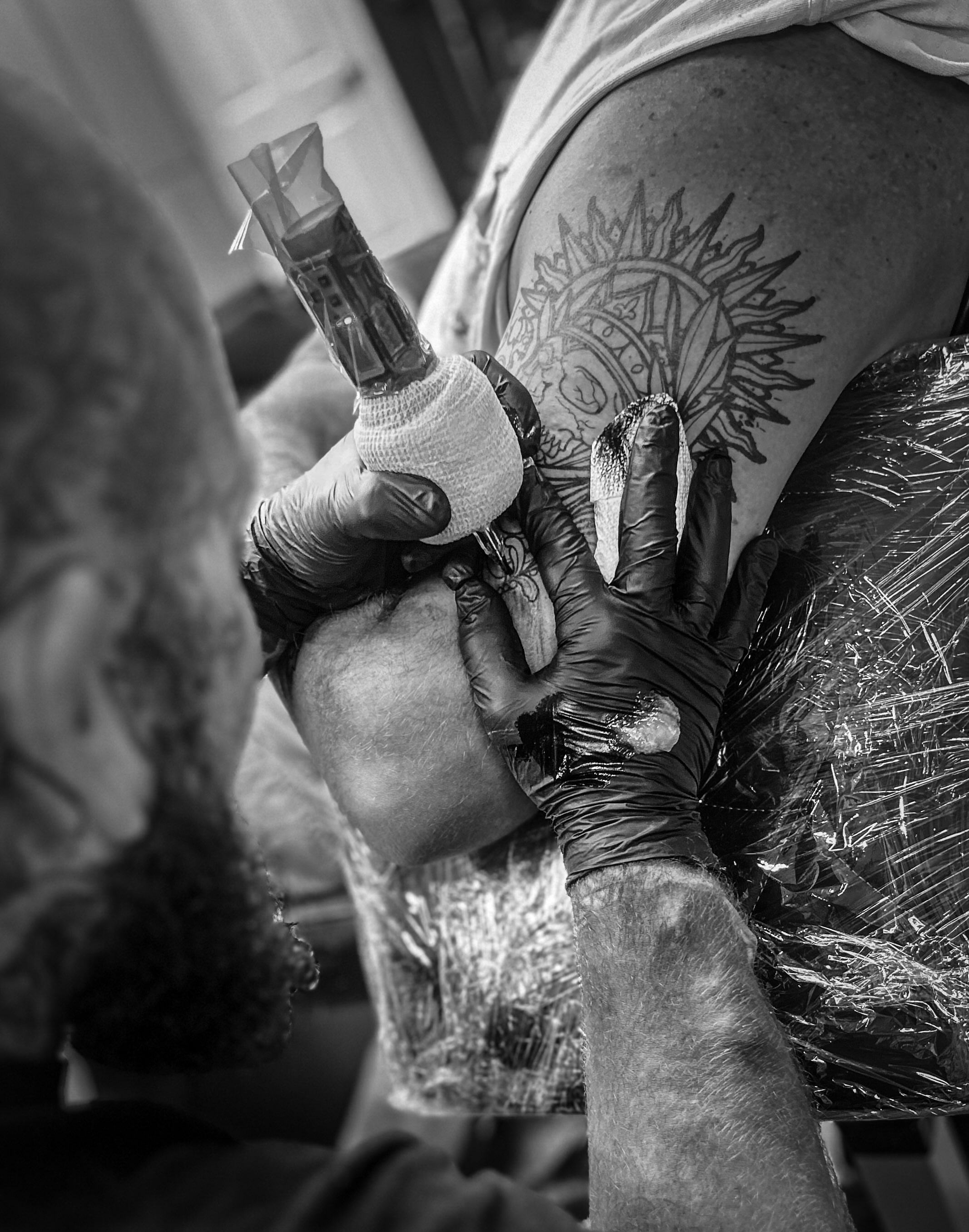 Sun and compass American traditional tattoo on the shoulder by Andres Flores