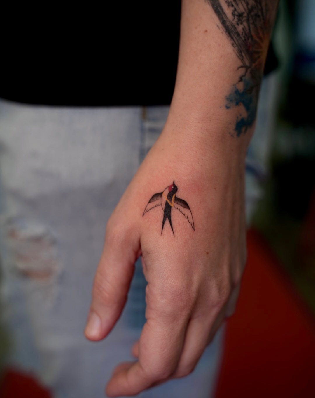 Bird neo-traditional tattoo on the hand by 🤍 Sarah 🖤