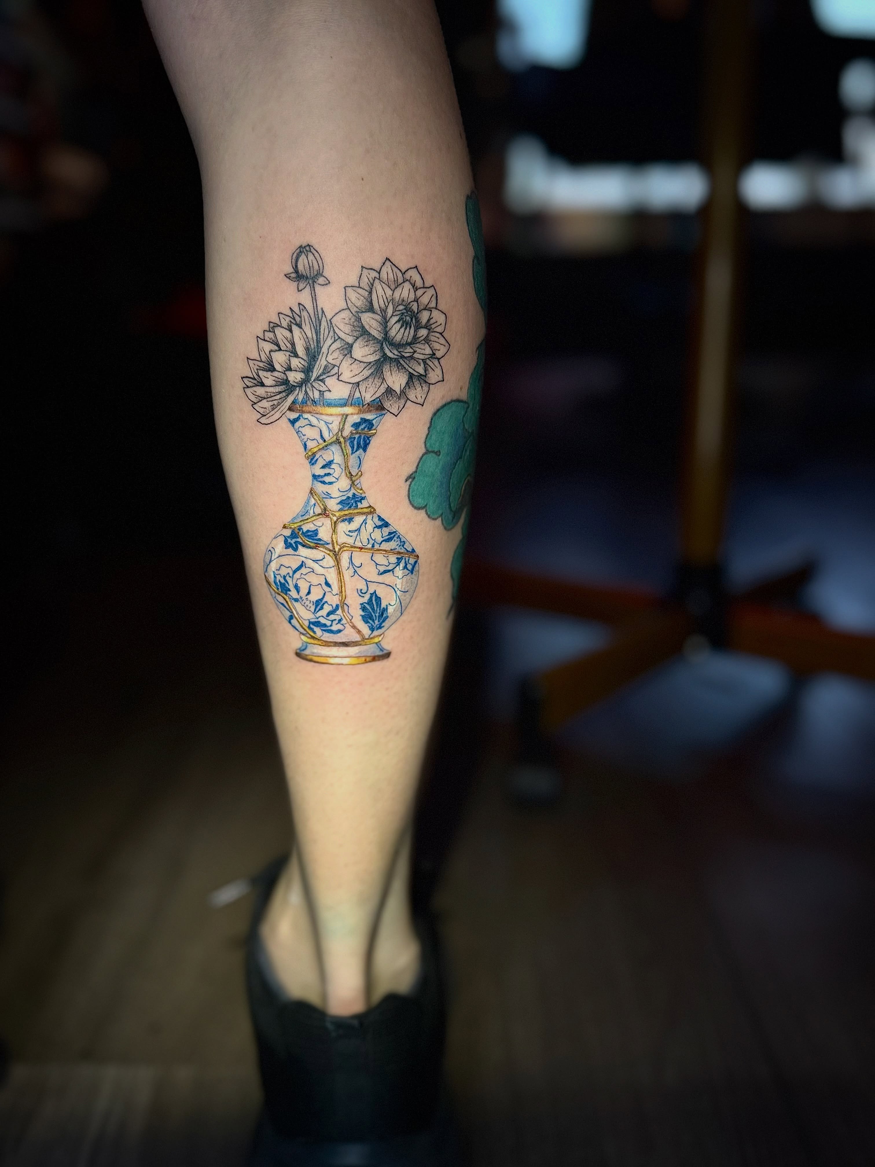 Vase with flowers dotwork tattoo on the forearm by Honey