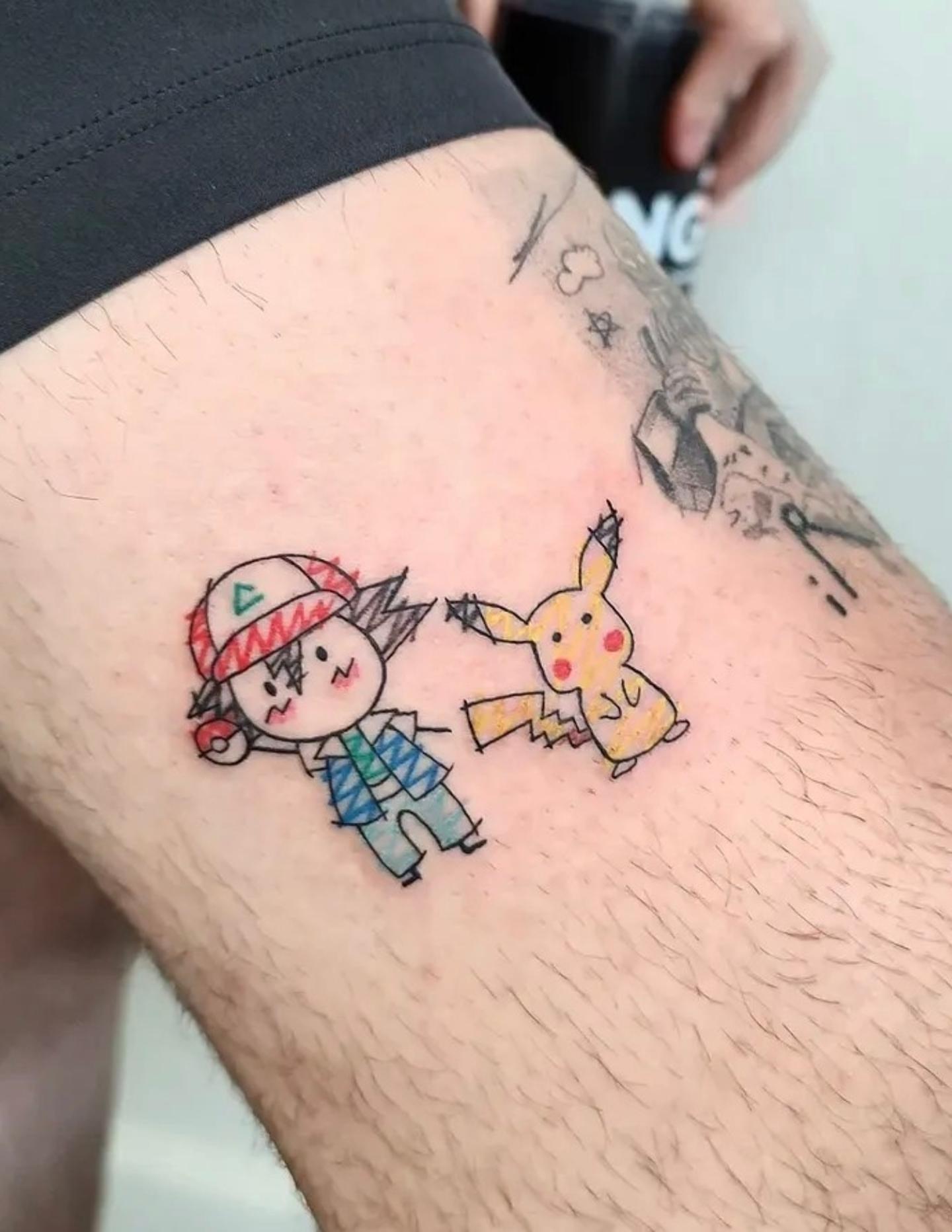 Pikachu and trainer anime tattoo on the thigh by Tucker