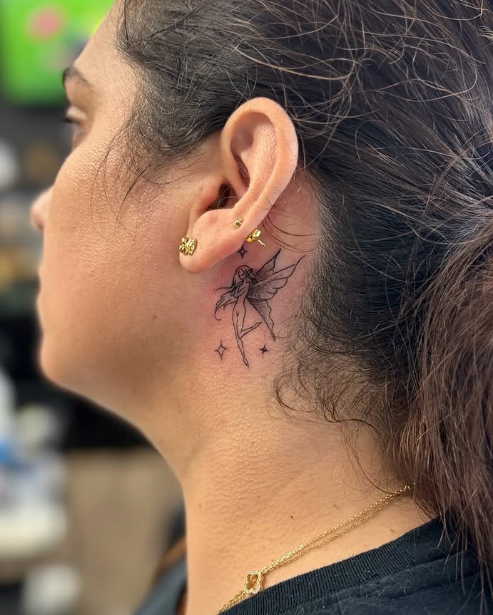 Fairy fine line tattoo on the neck by David