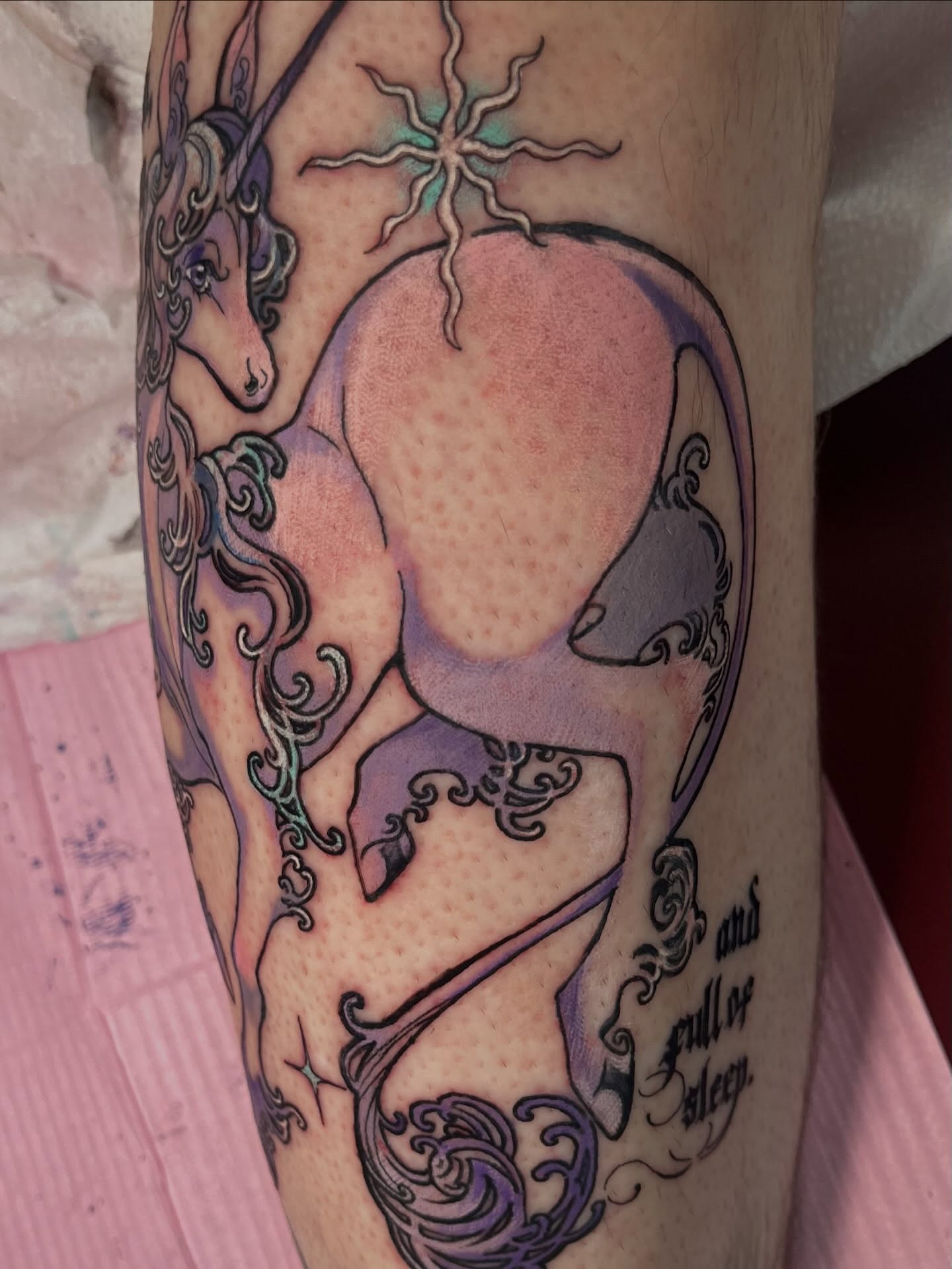 Unicorns and moon dotwork tattoo on the forearm by Cami Rose