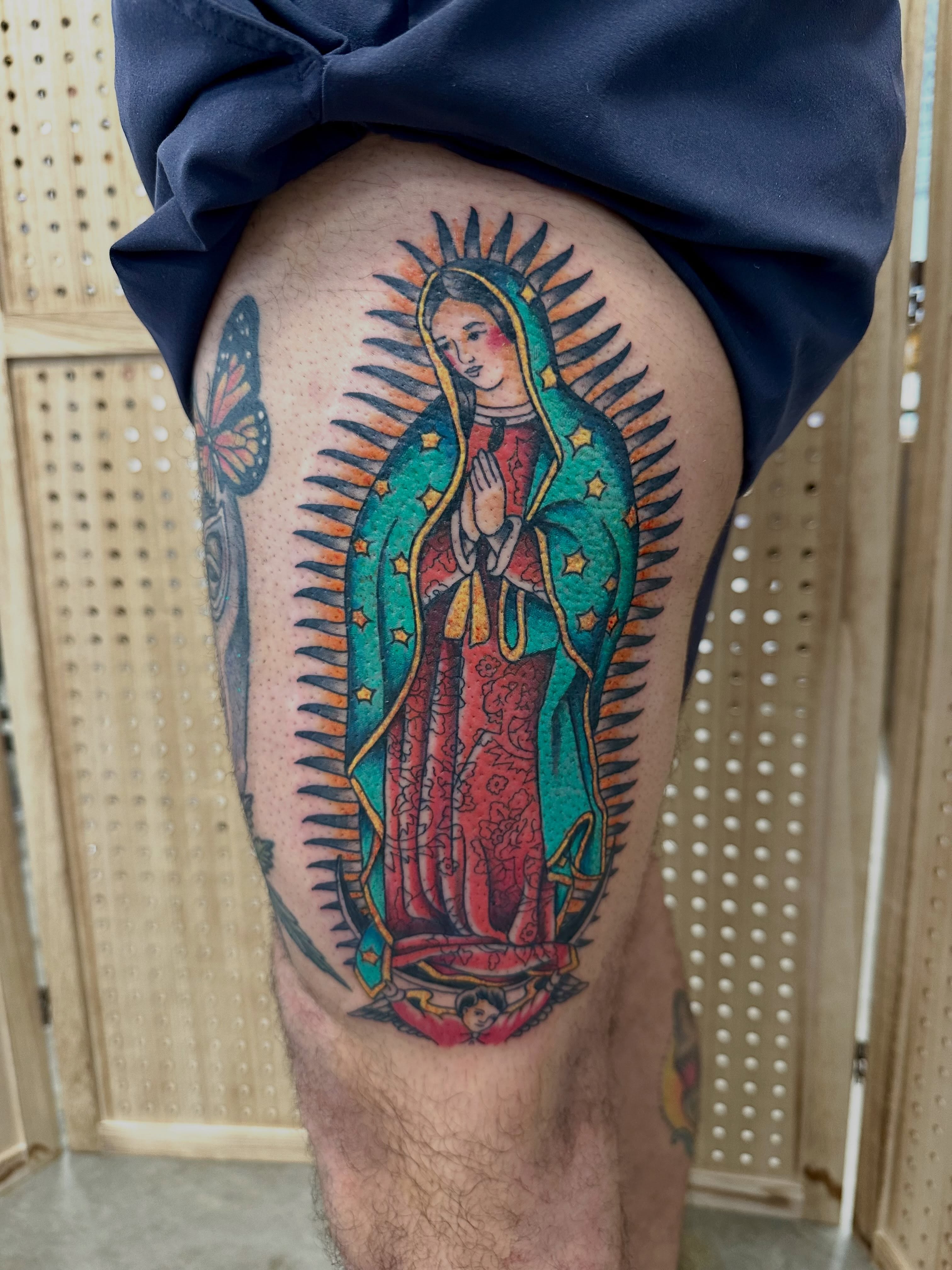 Our Lady of Guadalupe American traditional tattoo on the thigh by Vincent Merys