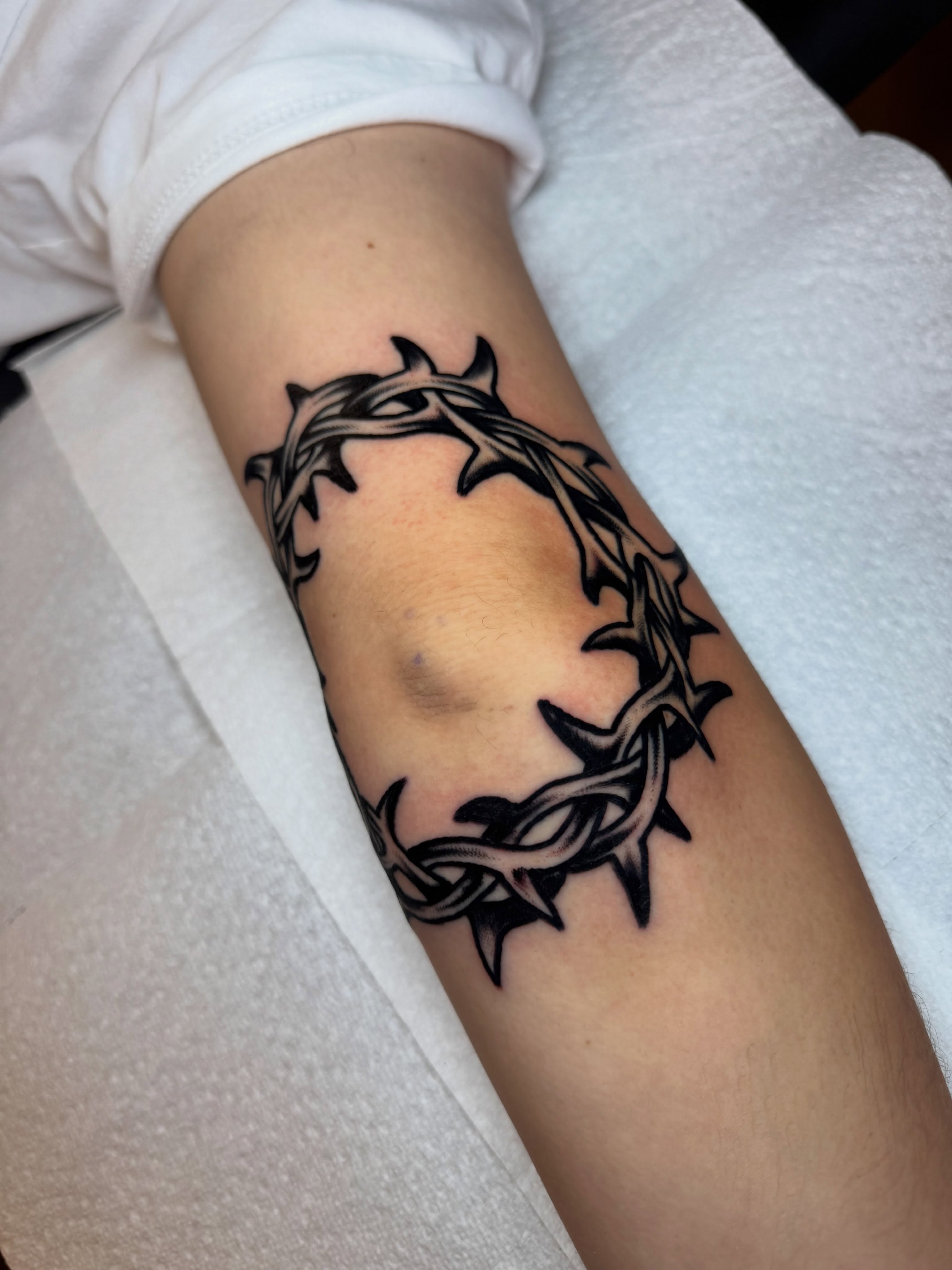 Crown of thorns black and grey tattoo on the forearm by Jonathan Clapp, San Antonio, Texas