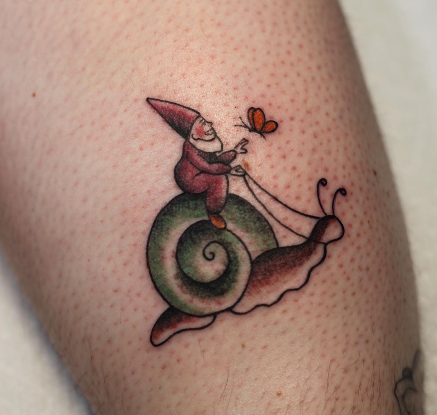 Gnome riding snail illustrative tattoo on the forearm by adrienne mae ❀