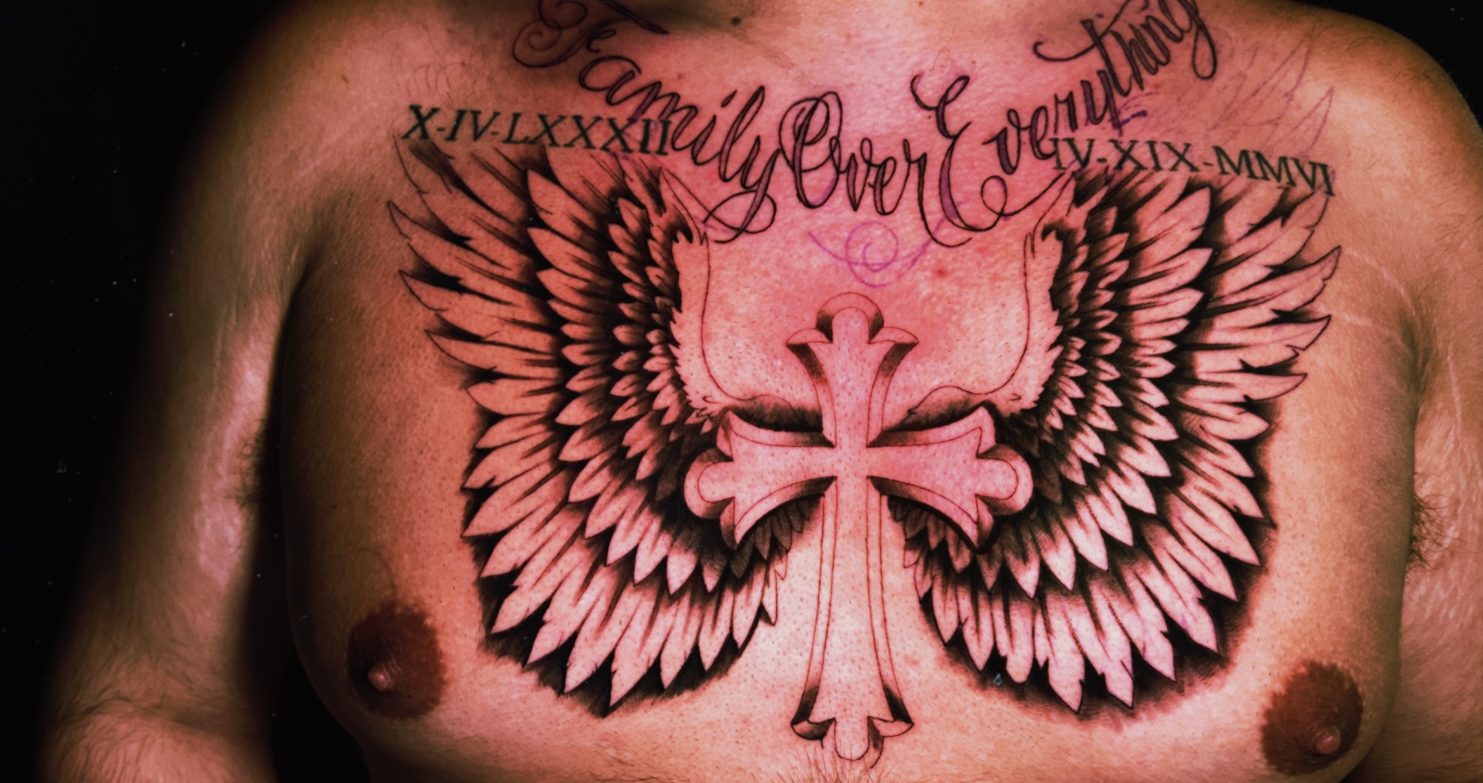 Cross with wings American traditional tattoo on the chest by Tito Cross ❤️‍🔥