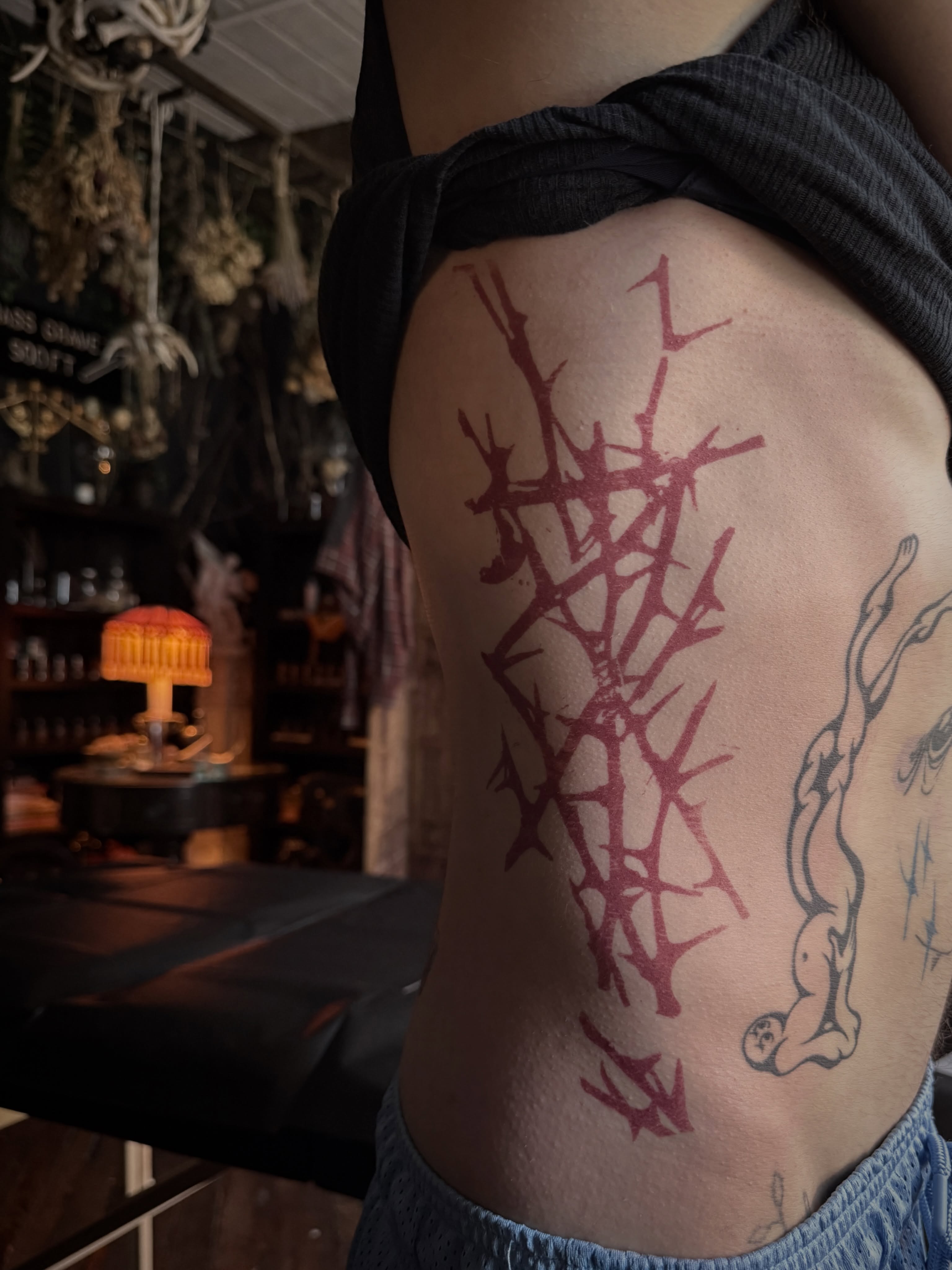 Thorn crown geometric tattoo on the ribs by Jamie Draven 🐺