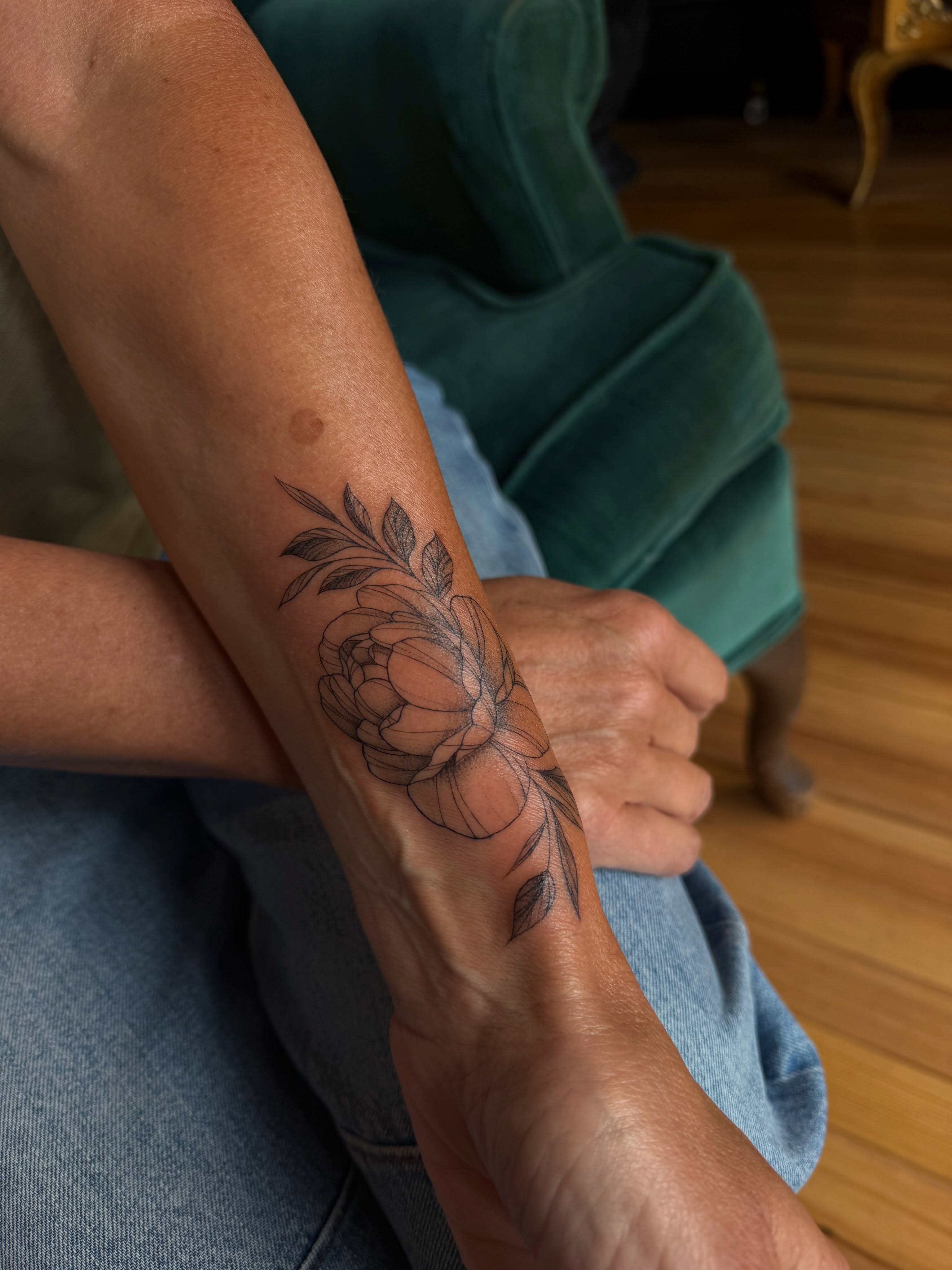 Peony black and grey tattoo on the forearm by Allison