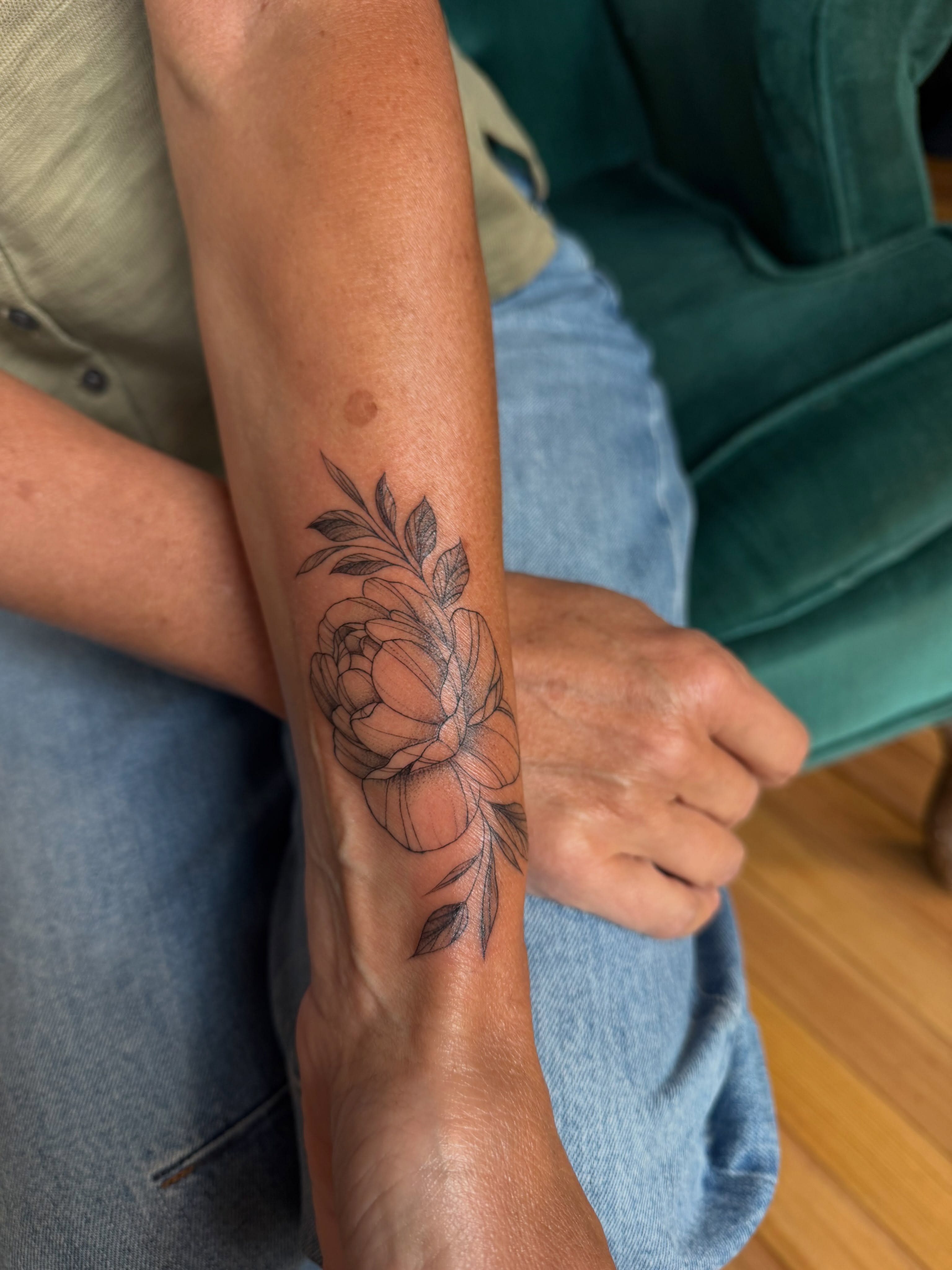 Peony black and grey tattoo on the forearm by Allison
