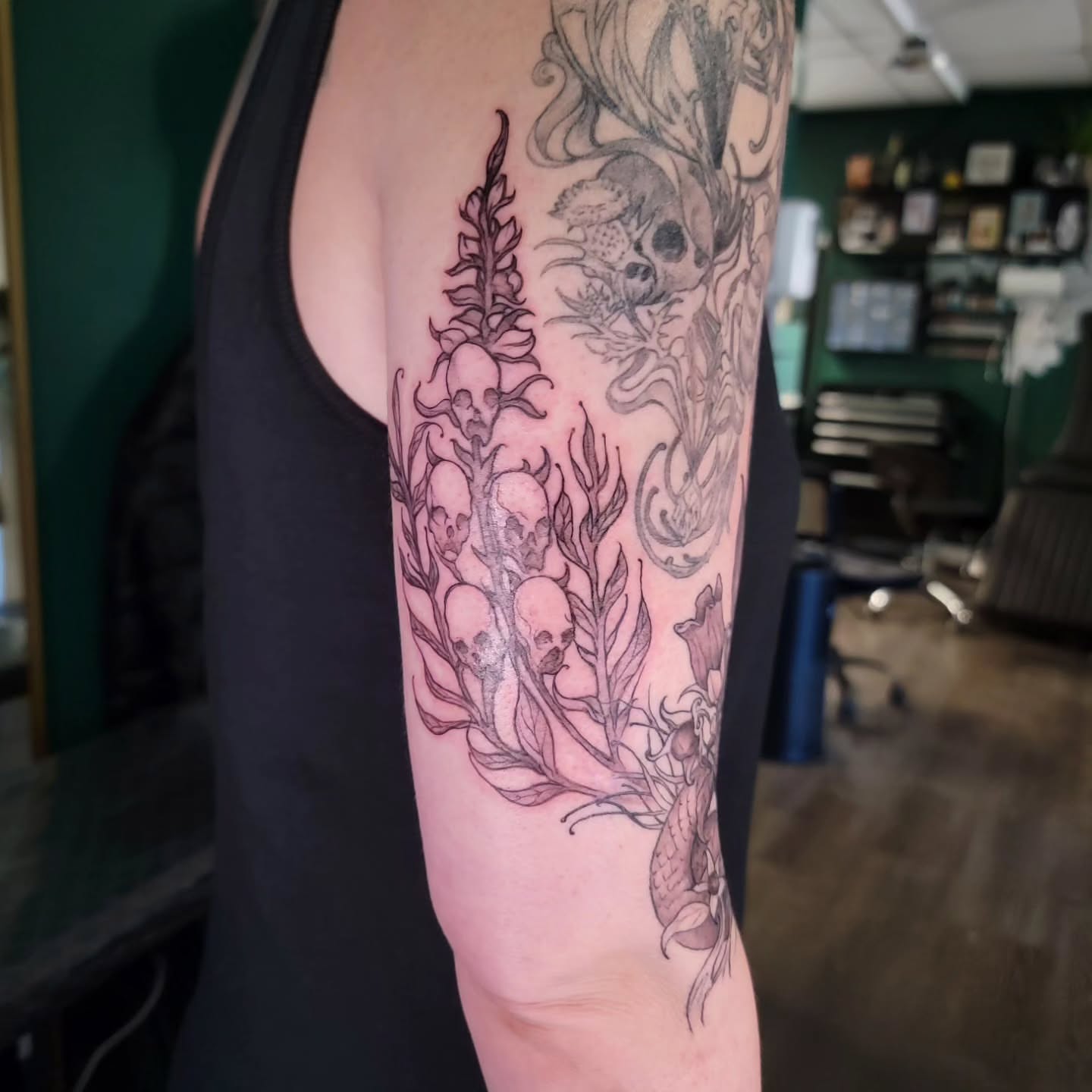 Underwater flora and skulls realism tattoo on the forearm by Nathan Harkins-Oberbeck