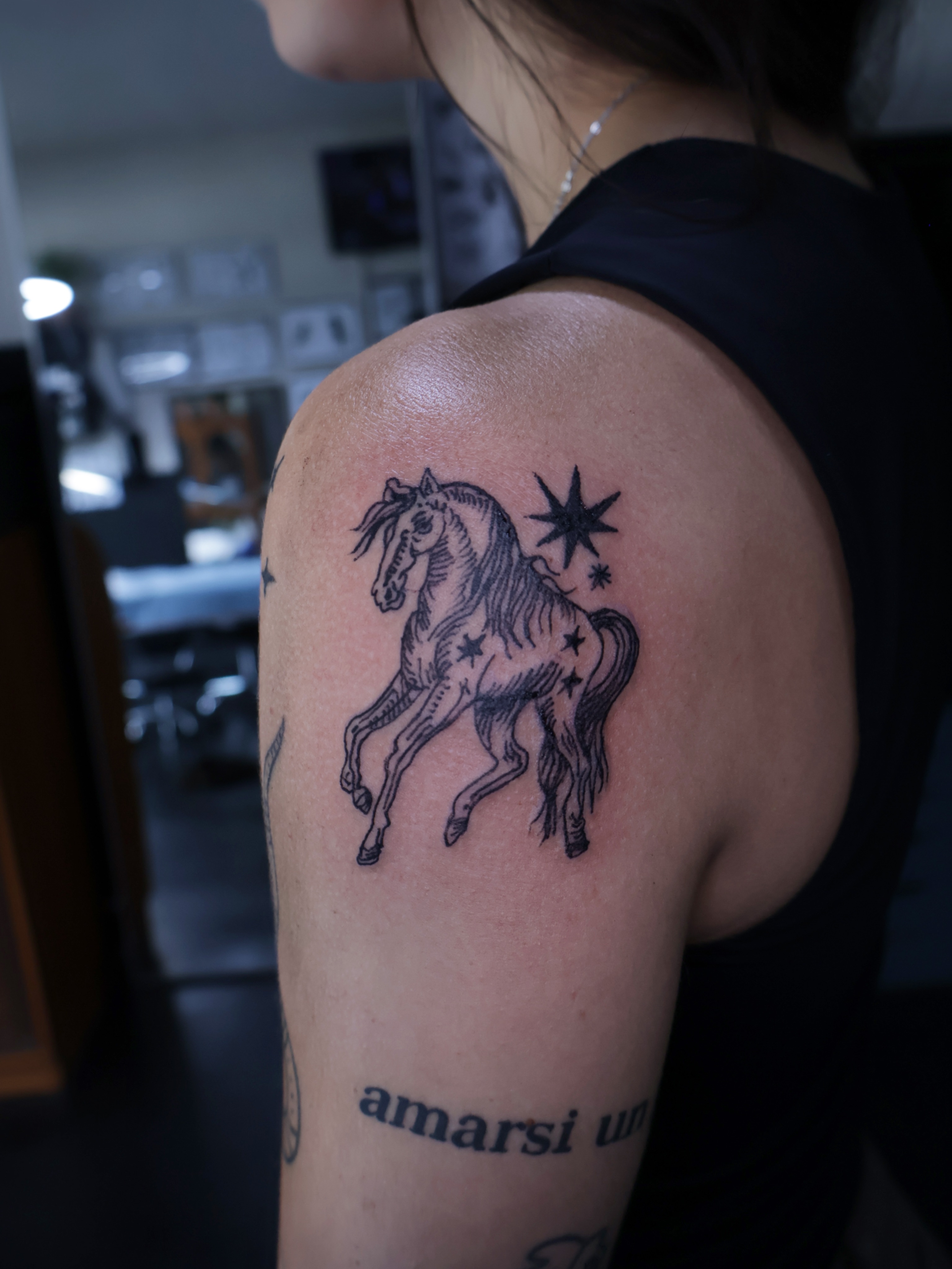 Galloping horse black and grey tattoo on the shoulder by Denis Du Preez, East Williamsburg, Brooklyn
